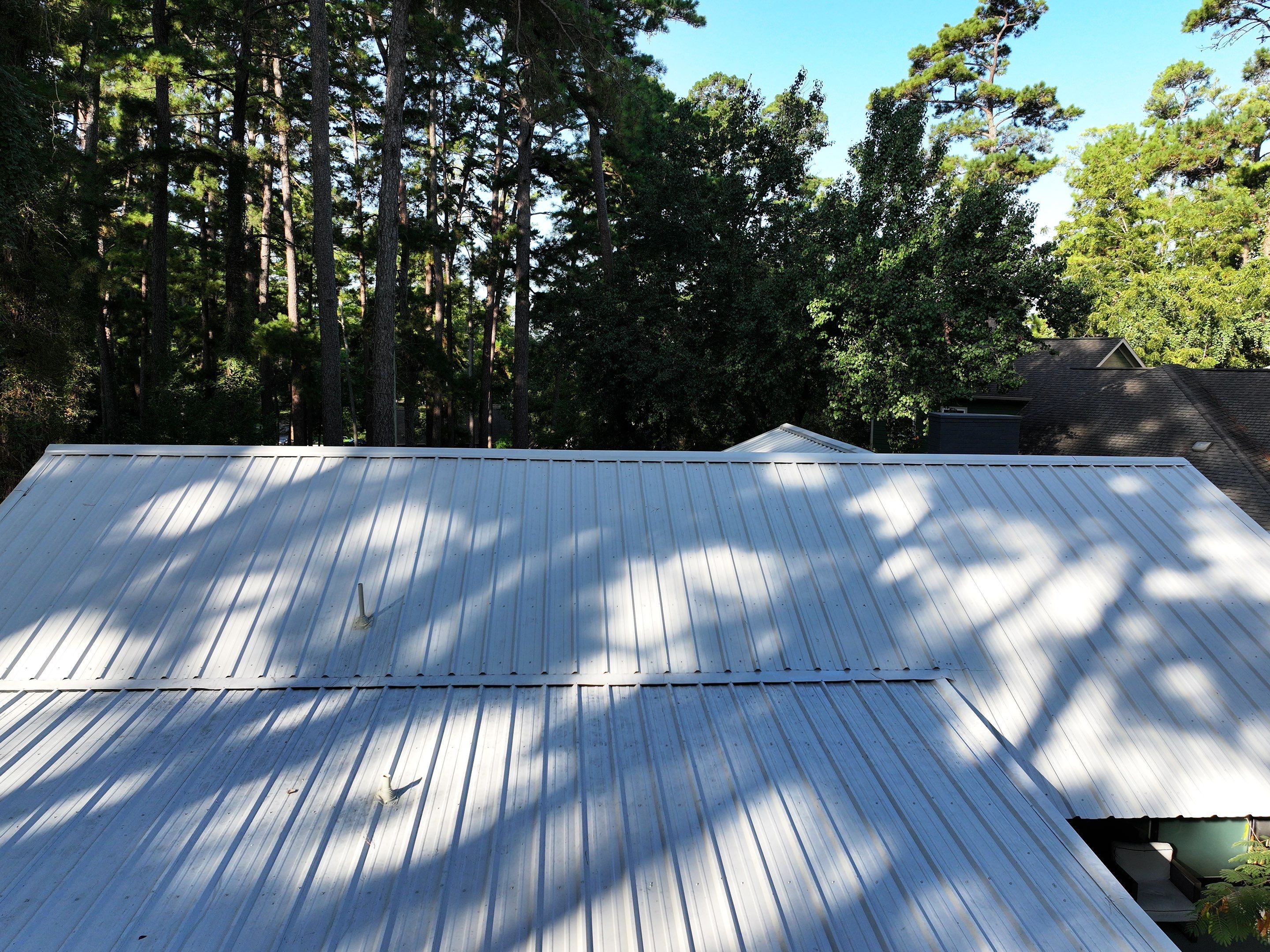 White Standing Seam Metal Roof Replacement in Willis, Texas by Abbott Roofing Company