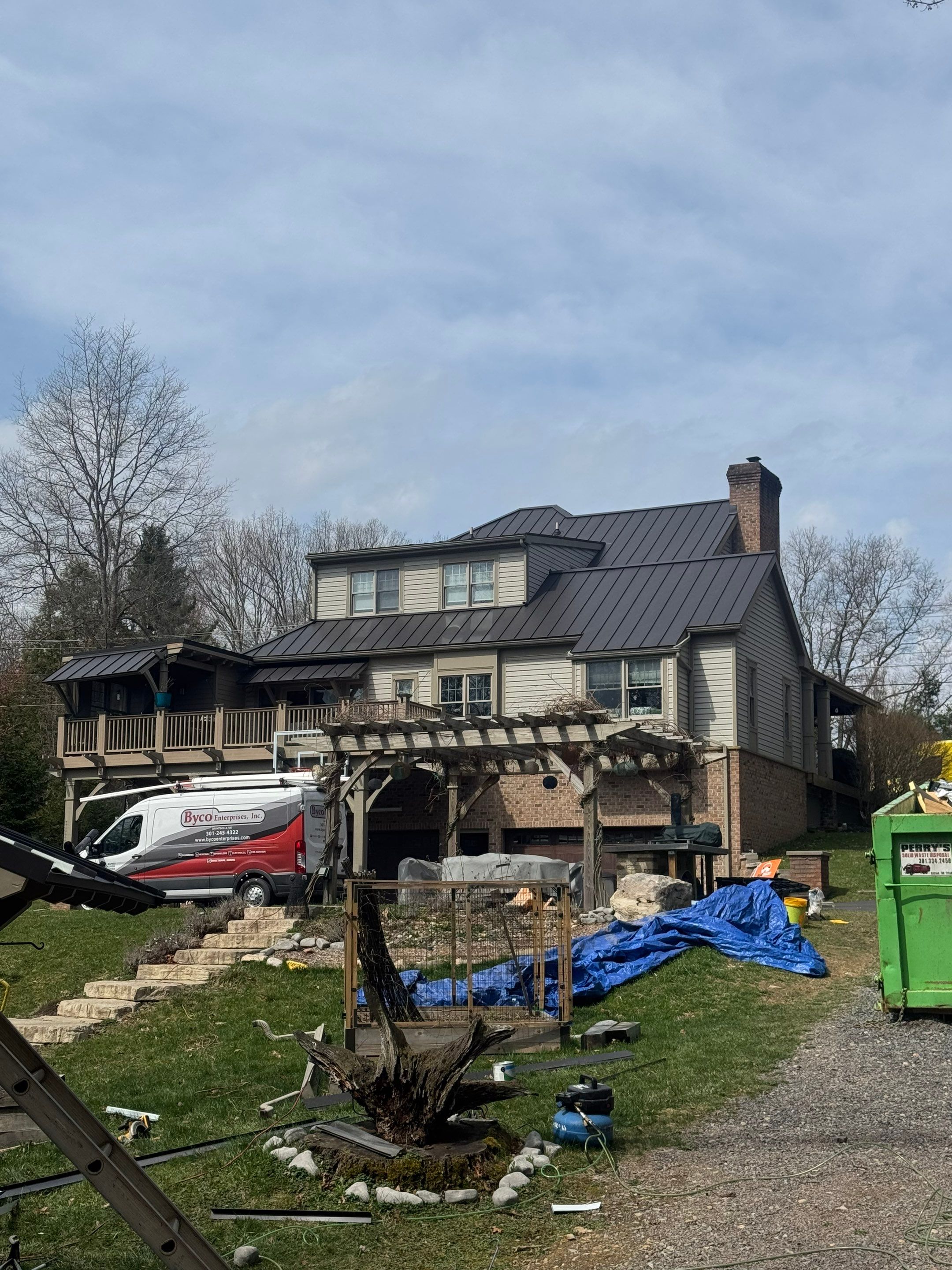 Metal Roof Replacement  by American Home Contractors