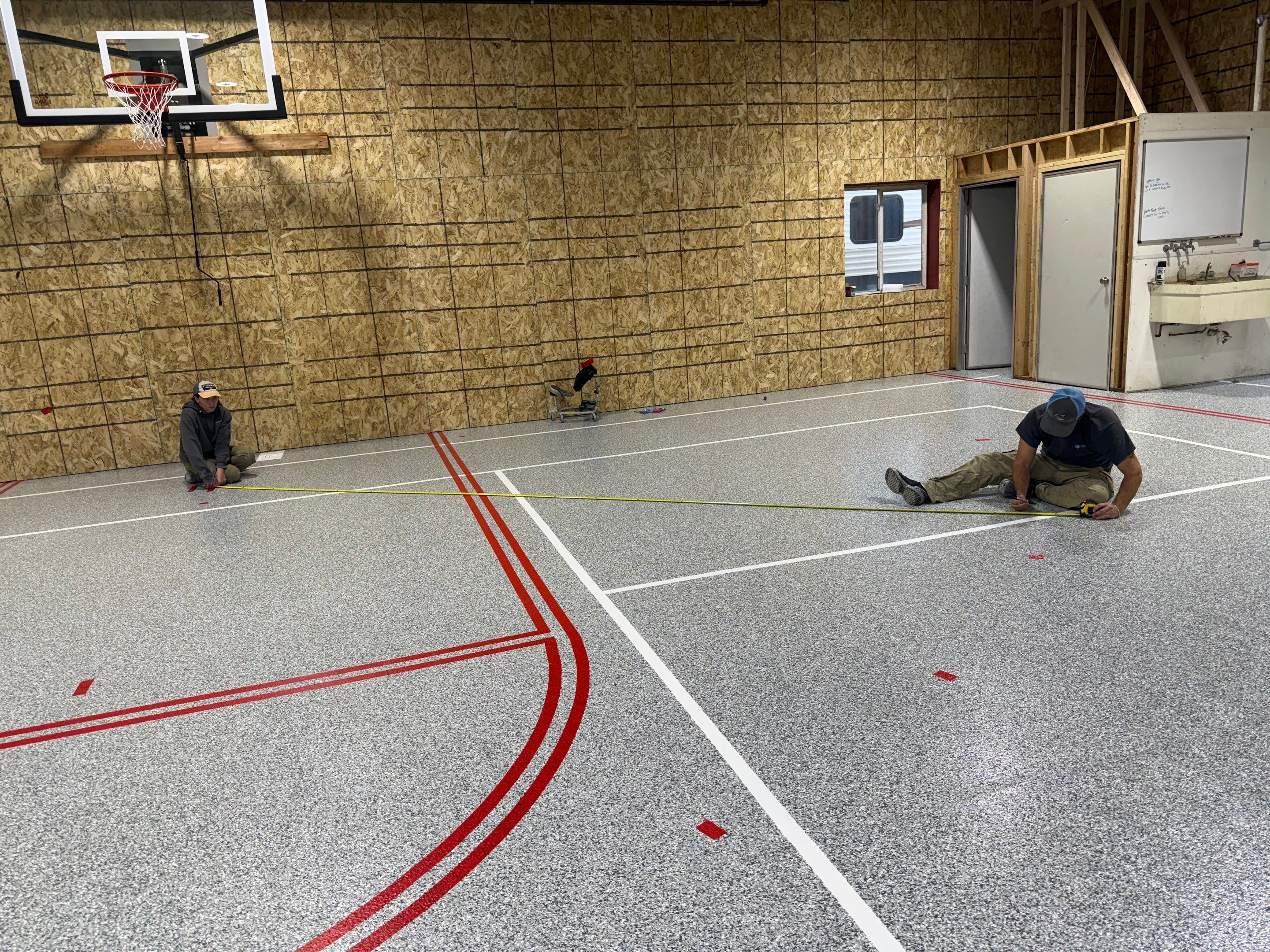 Custom Polyurea Shop Floor with Basketball Court Lines in Rock Valley by Select Painting, Coatings & Garage Cabinets