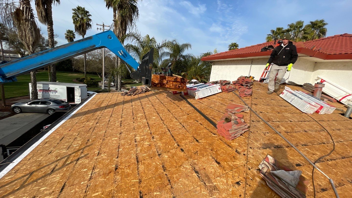 Tile refurbish project using existing tiles and replaced underlayment and battens by Straight Edge Roofing Inc