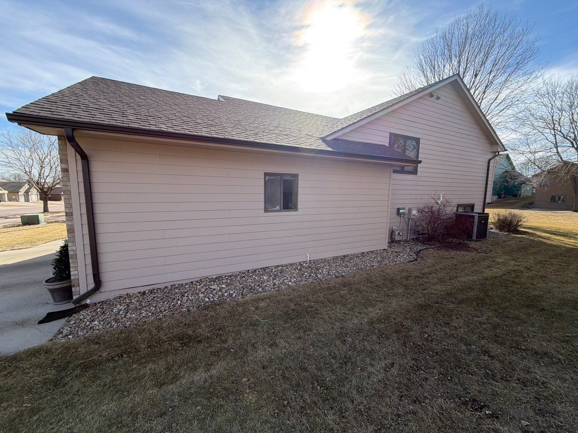 Residential Exterior Painting and Trim Restoration in Sioux Falls by Select Painting, Coatings & Garage Cabinets