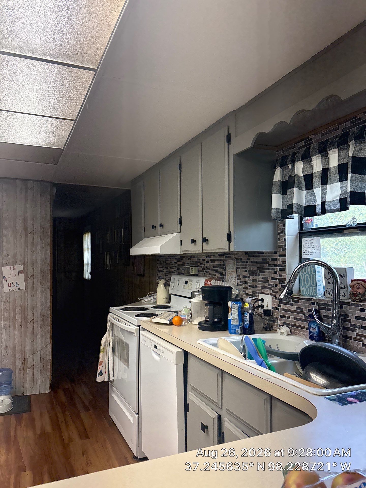 Modernized Kitchen with Gray Painted Cabinets and Tile Backsplash by CompanyCam Sales Demo