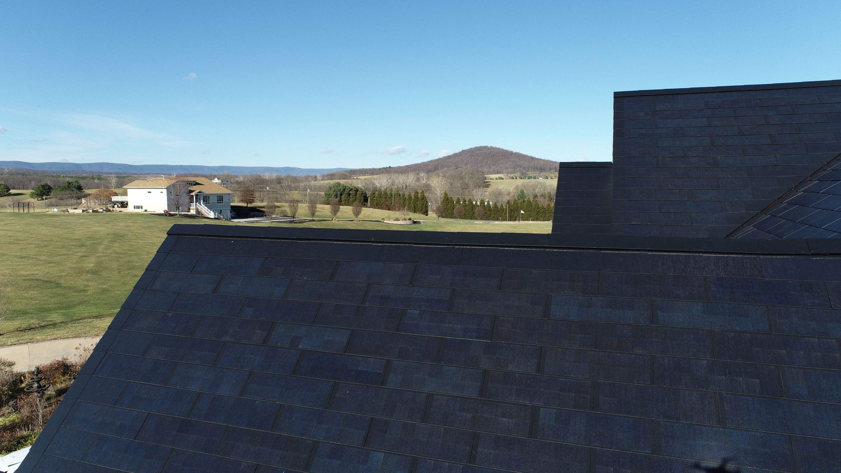 Tesla Solar Roof Replacement  by American Home Contractors