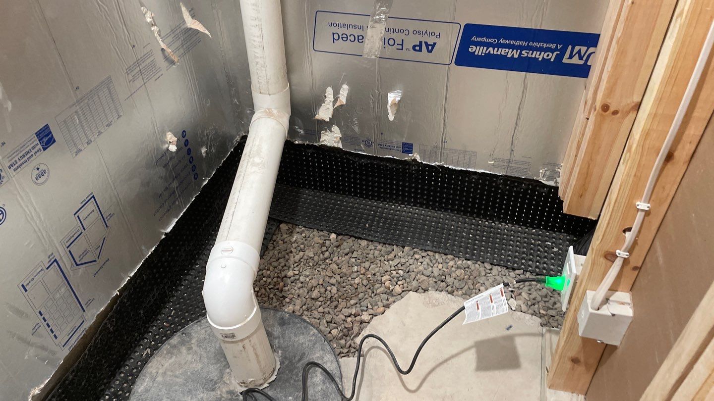Interior Drain Tile & Buried Discharge in St. Anthony, MN by Waterproofing Northeast
