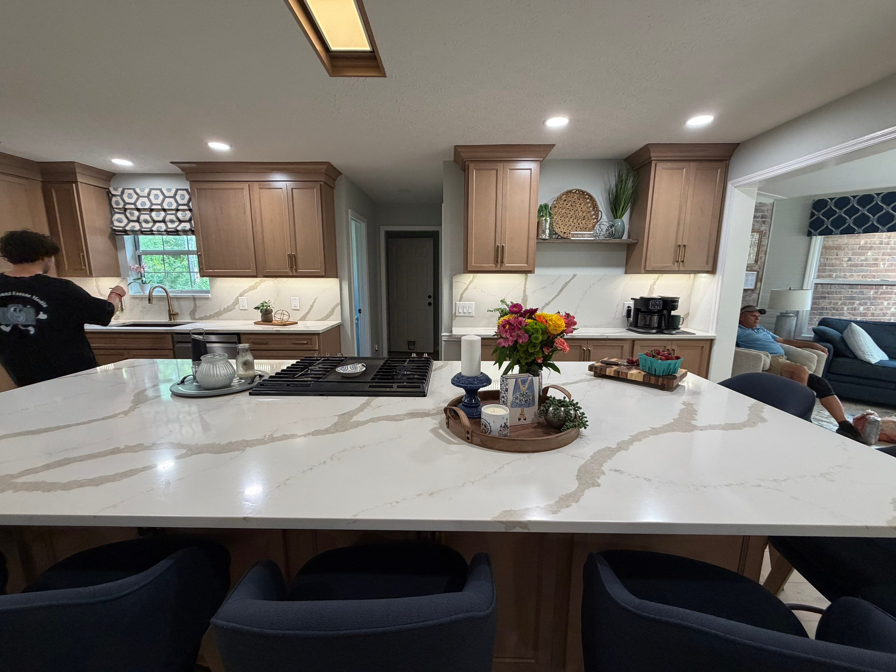 Modern Kitchen Remodel Featuring Quartz Backsplash, under cabinet lighintg, and a coffee bar in Mt. Juliet Tennessee by DeRo Renovations,LLC