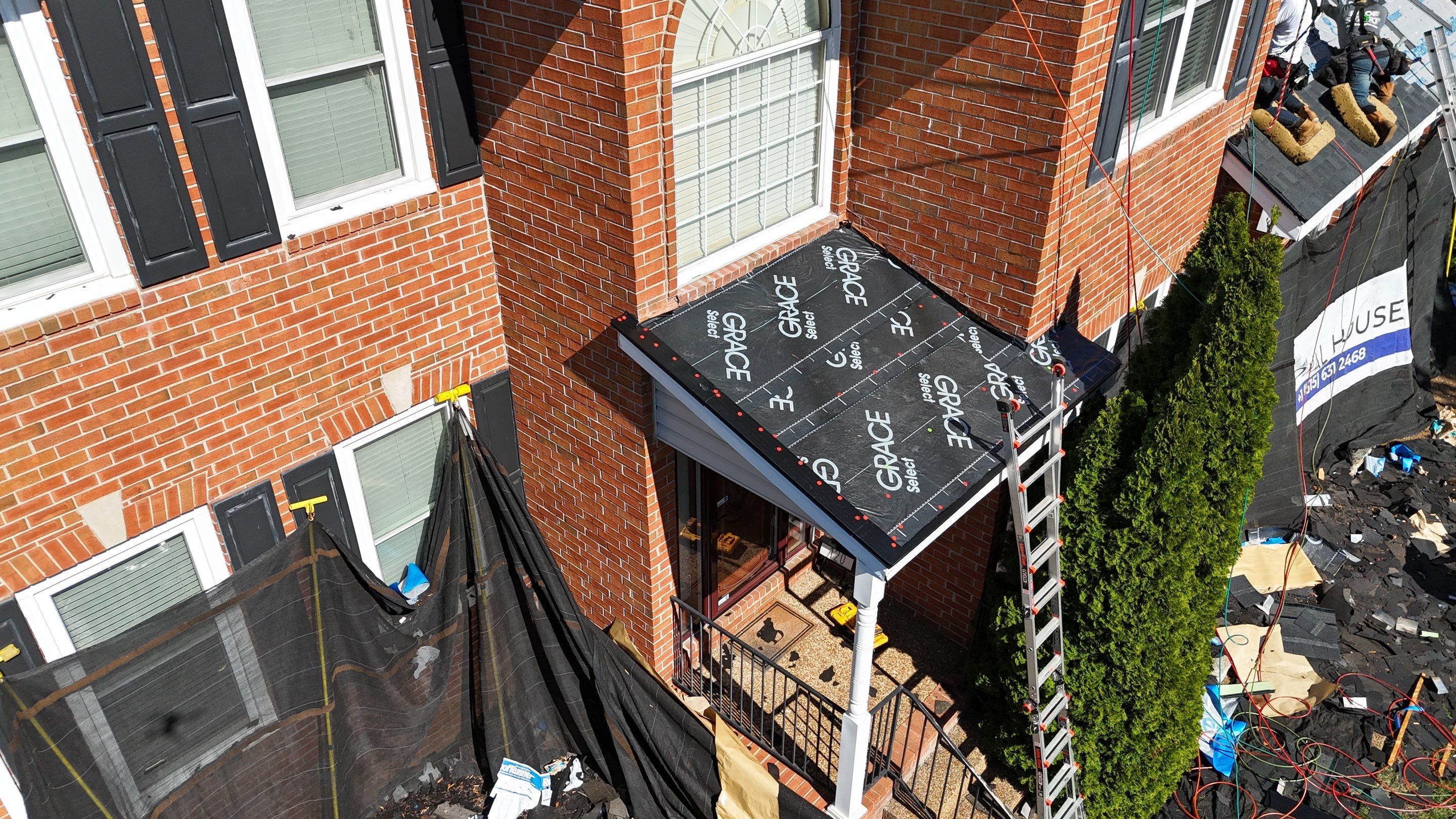 Charcoal Black Re-Roof & Gutters by Royal House LLC