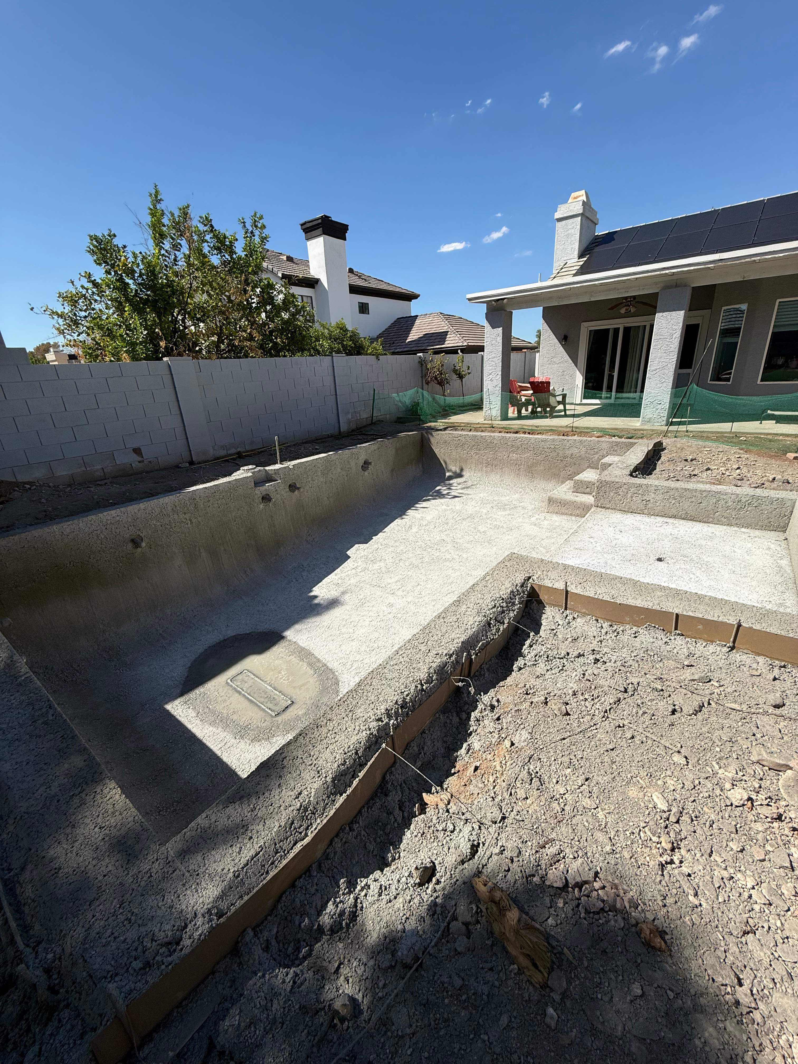 Pool build with baja step and pebble finish by Modern Pools