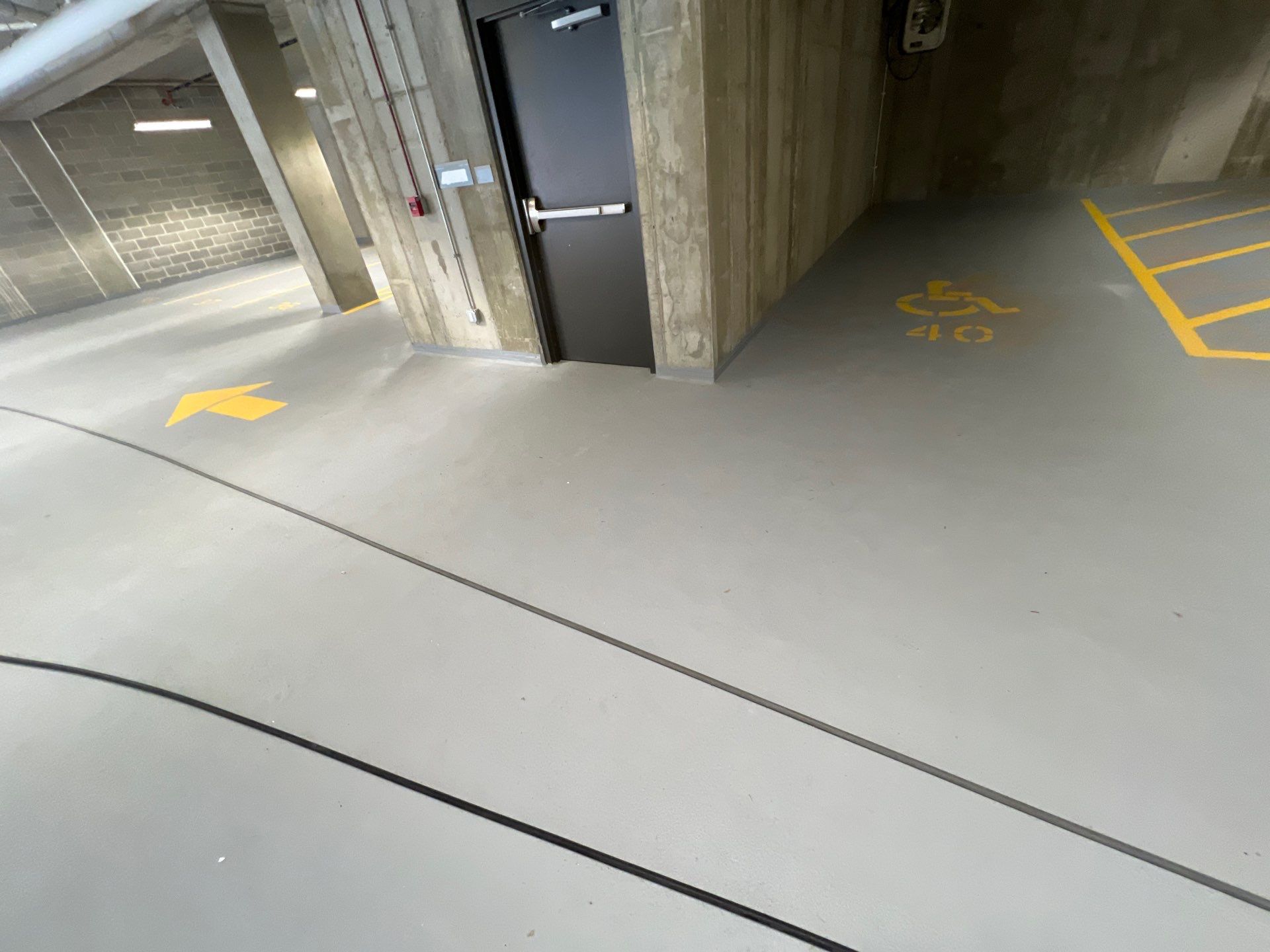 Parking garage using Hot water by Northern Power Washing LLC.