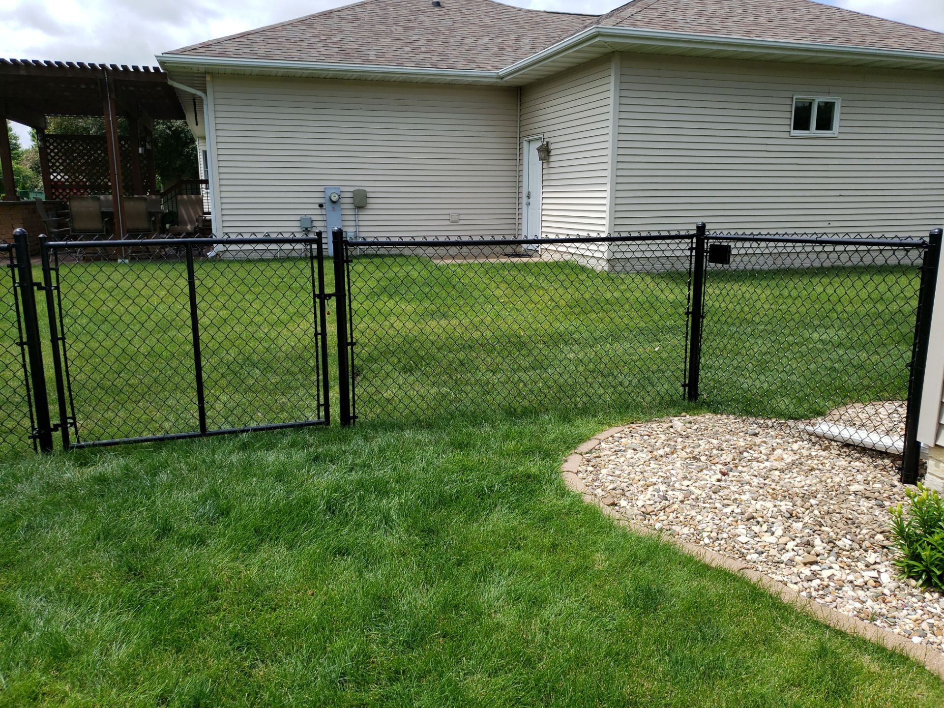 Black Vinyl-Coated Chain Link Fence Installation in Denver by Perfect Picket Fence and Stain
