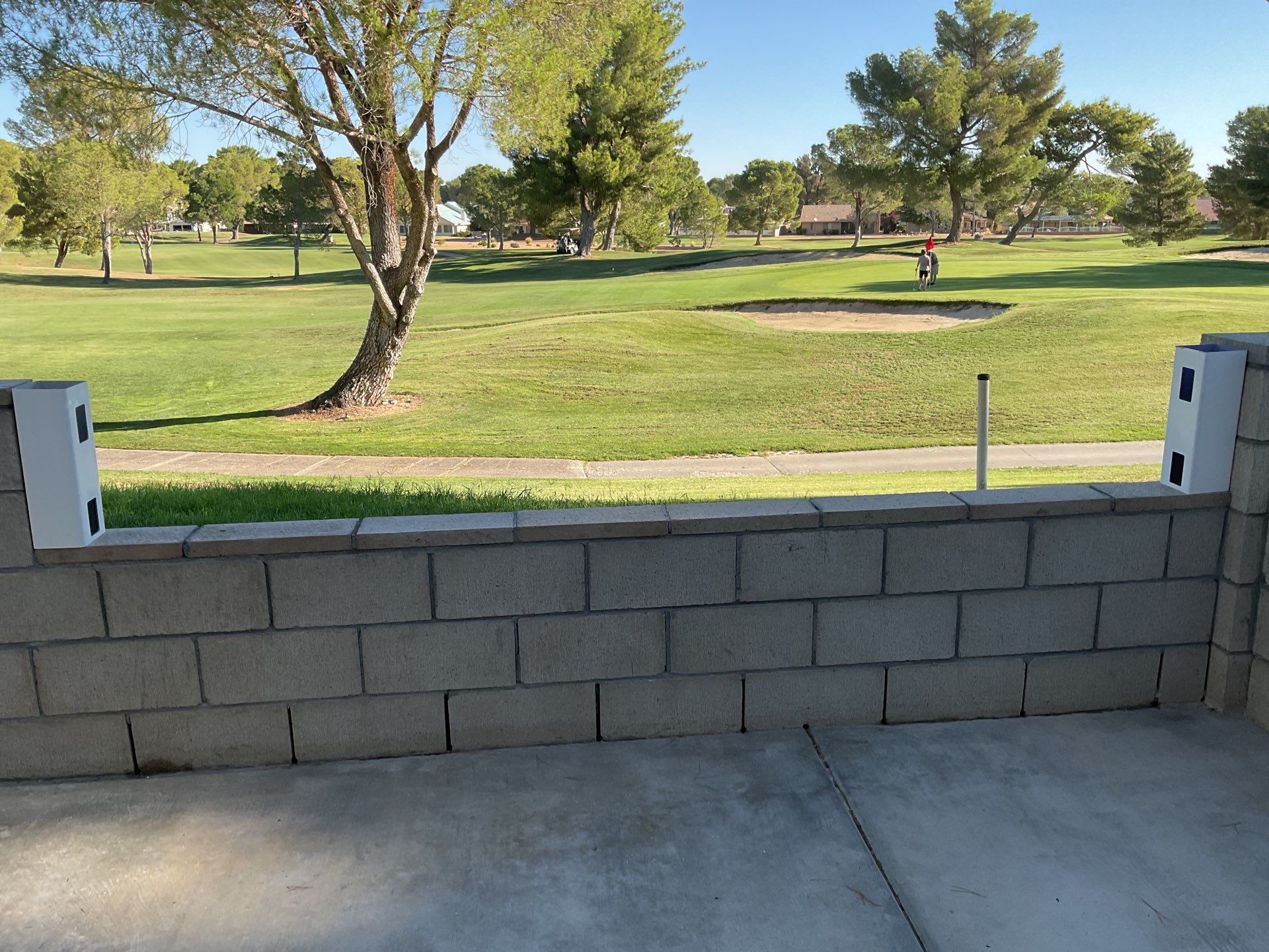 White Box Picket Fence on top of block wall  by Fence Guys Inc. 