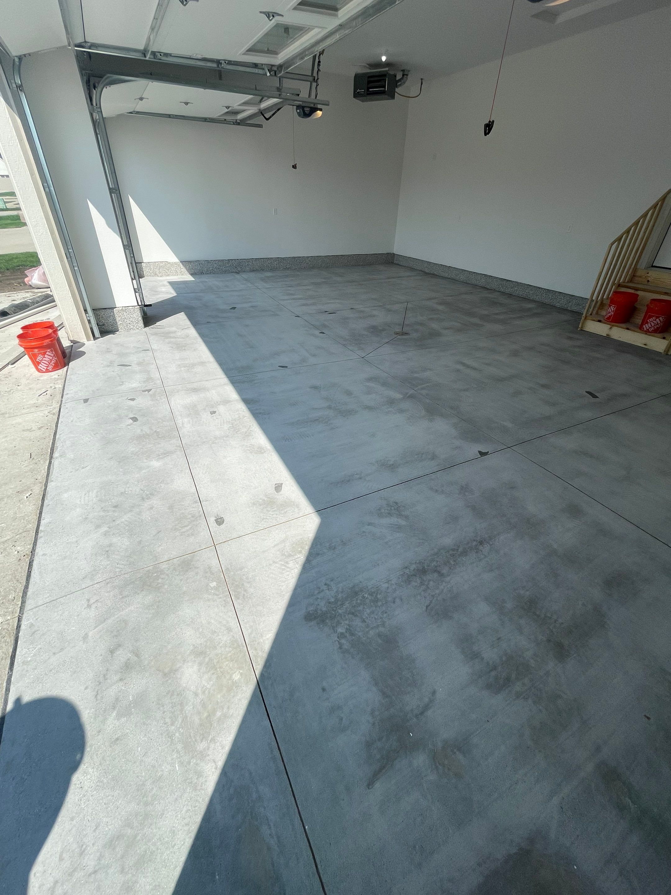 Grey Speckled Garage Floor Coating in Sioux Falls by Select Painting, Coatings & Garage Cabinets