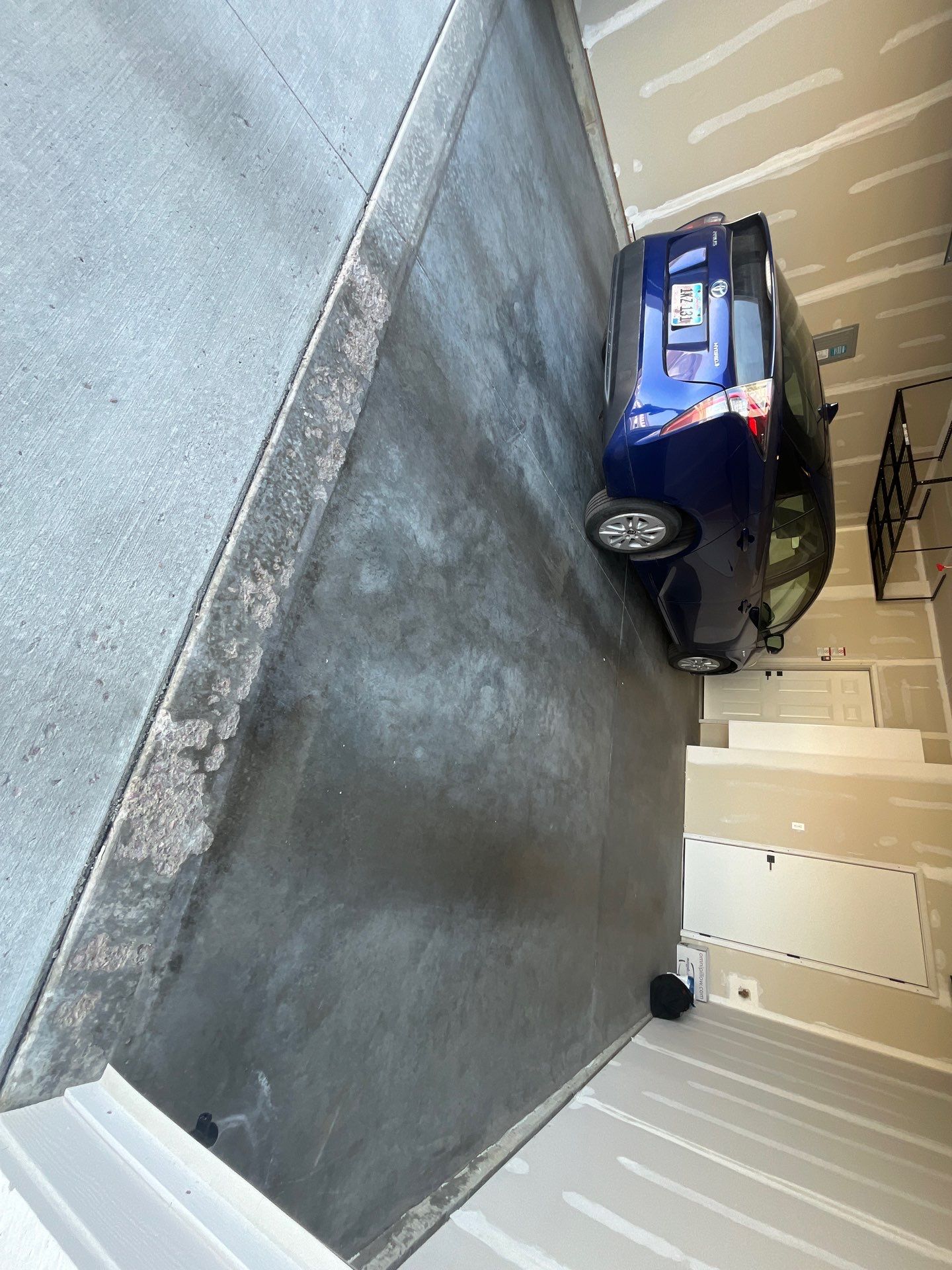 Custom Coyote Flake Garage Floor Coating in Sioux Falls by Select Painting, Coatings & Garage Cabinets