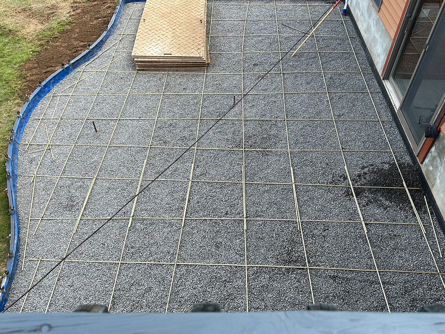 Bluestone textured concrete stamped patio  by NG Masonry & Construction LLC
