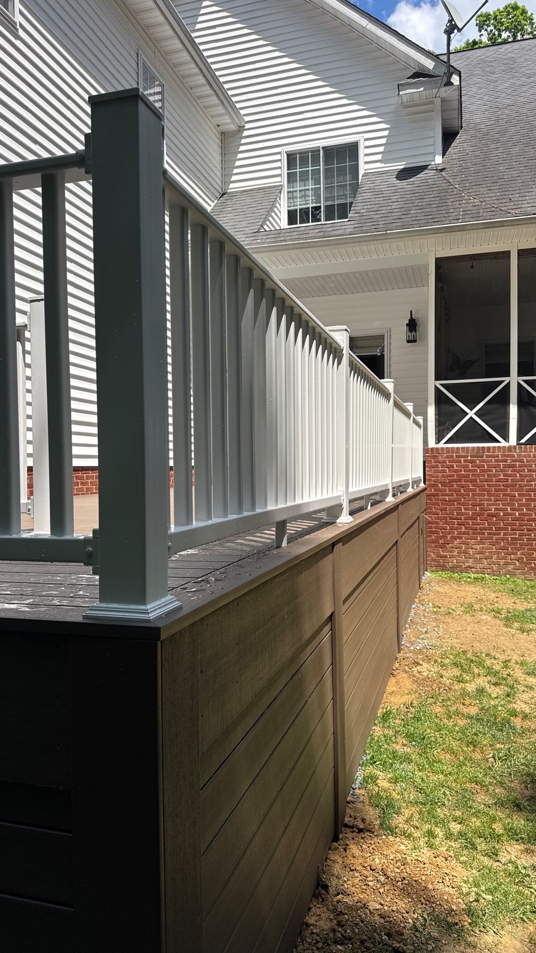 Custom Composite Deck and White Vinyl Railing Installation in Fayetteville by Walnut Hollow Decks & Outdoor Living