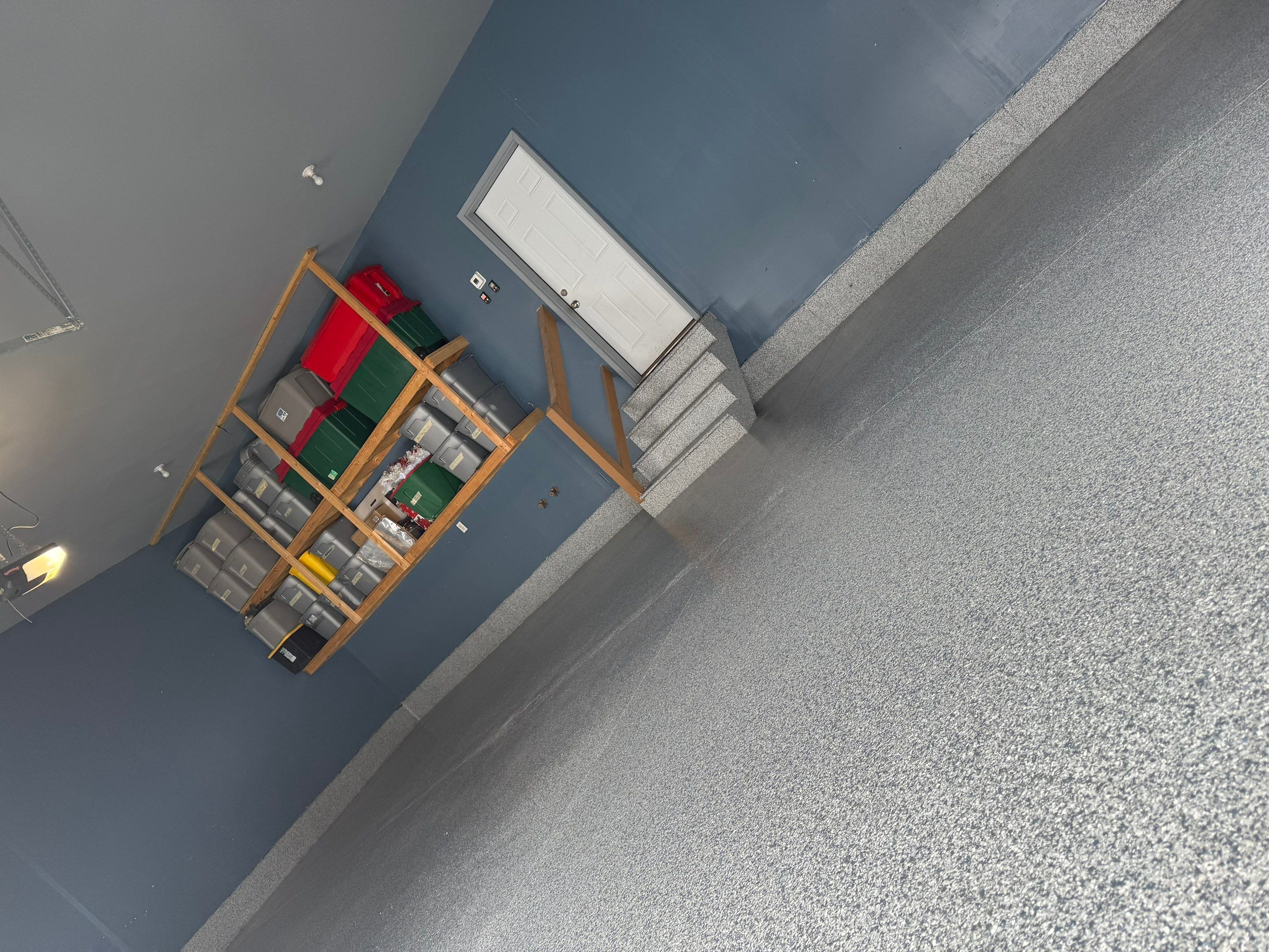 Grey Speckled Epoxy Garage Floor and Stair Coating in Sioux Falls by Select Painting, Coatings & Garage Cabinets