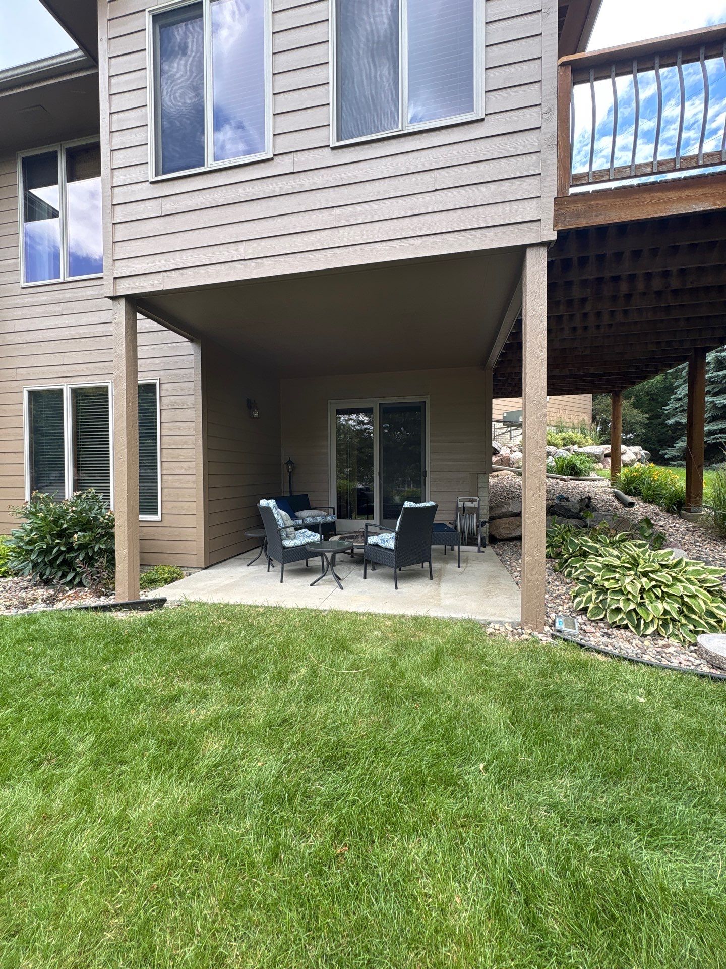 Multi-Story Residential Exterior Painting and Siding Refresh in Sioux Falls by Select Painting, Coatings & Garage Cabinets