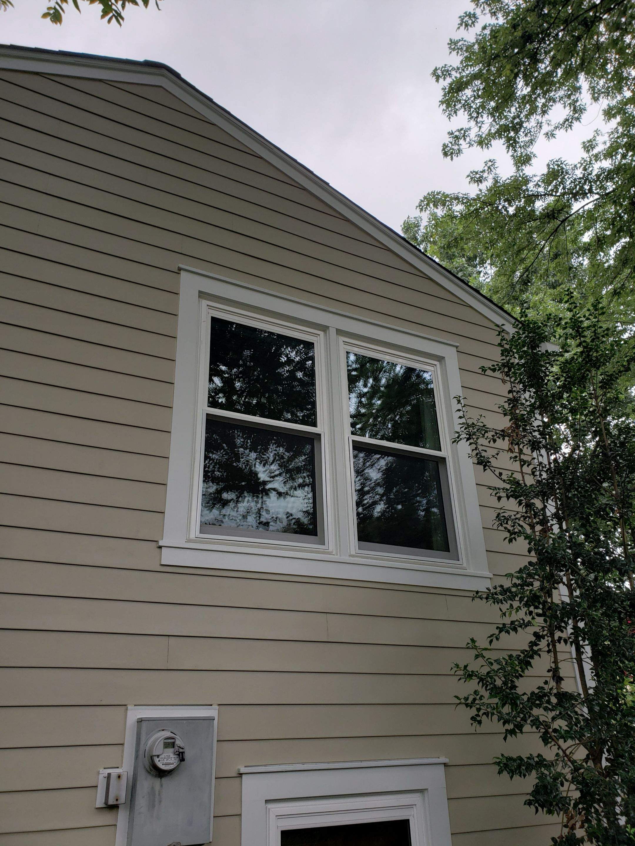 New composite windows and fiber cement siding with trim and gutters by Window Depot of Annapolis