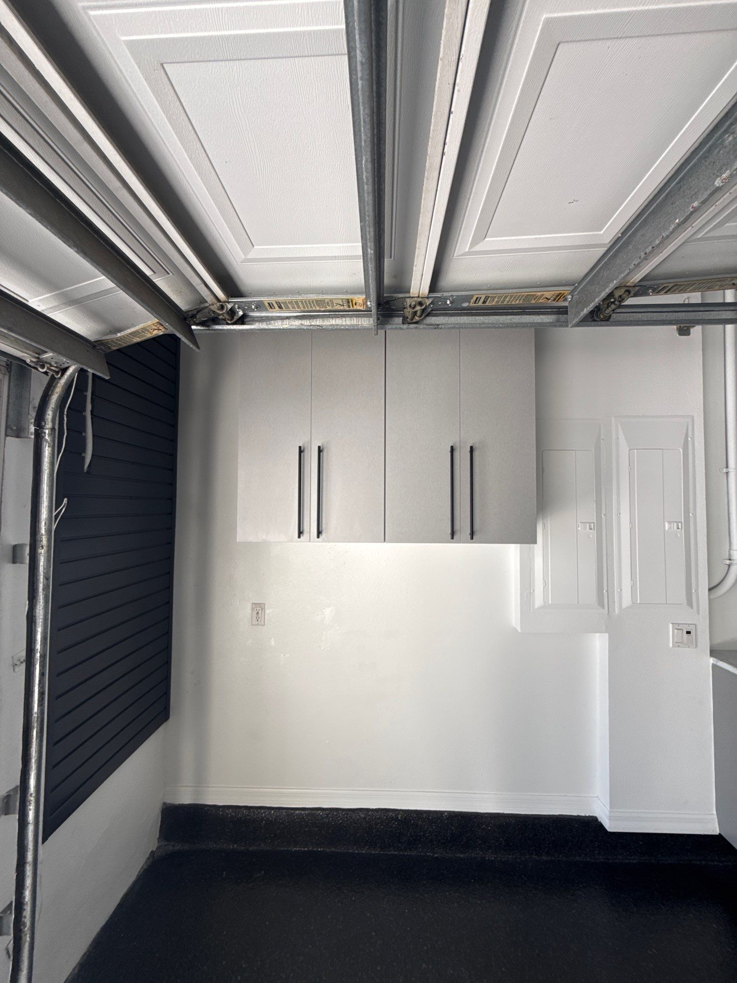 Tampa Garage Floor Coating and Overhead Storage Rack Installation by Square 1 Garage and Closet Solutions