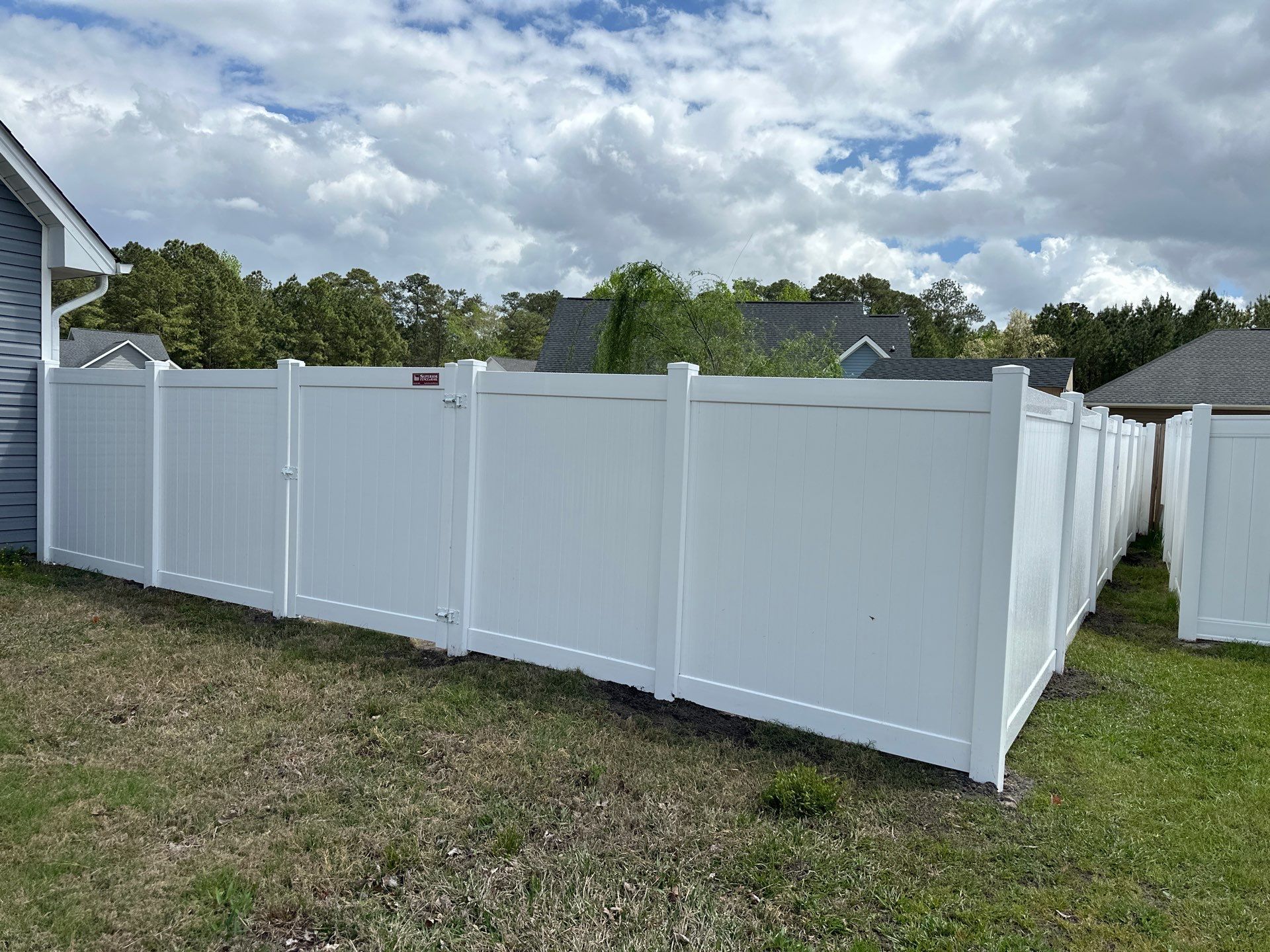 White Vinyl Privacy Fence Installation in Clinton by Superior Fence and Rail