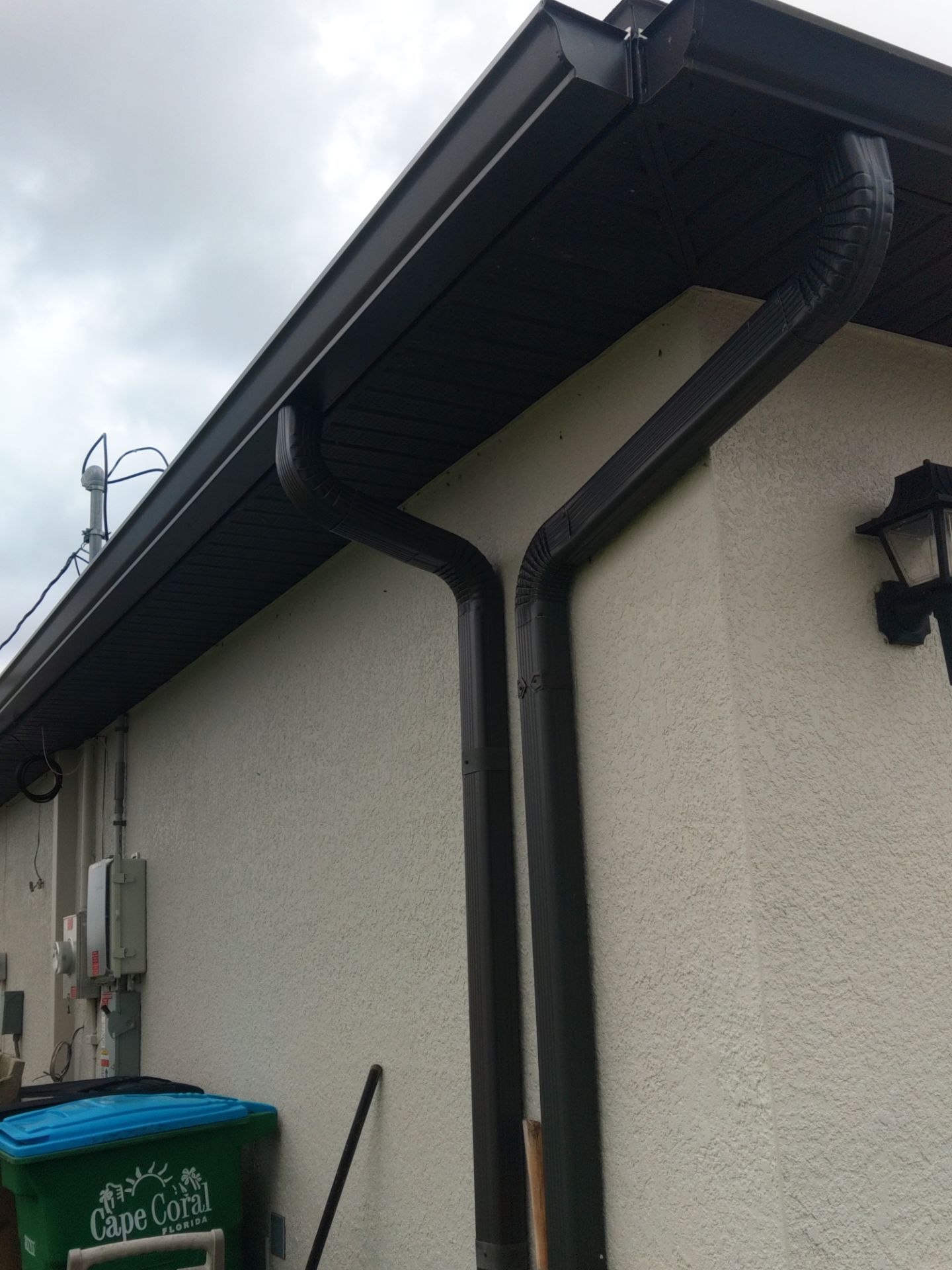 Black Seamless Gutters using black seamless gutters in Cape Coral FL by Gutter Professors