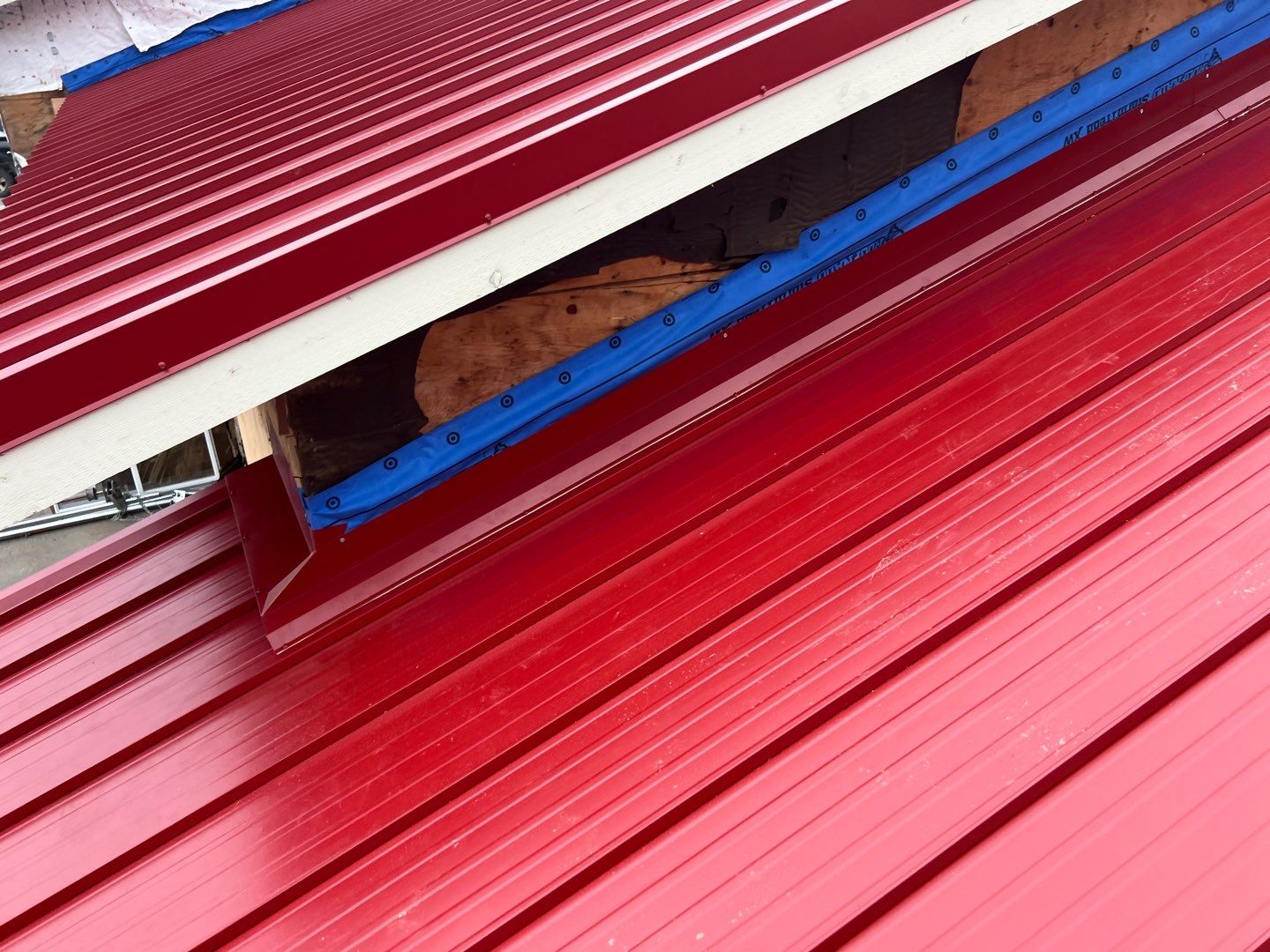 Commercial Roofing Installation using 12" Prolok metal  by Top Notch Roofing Inc