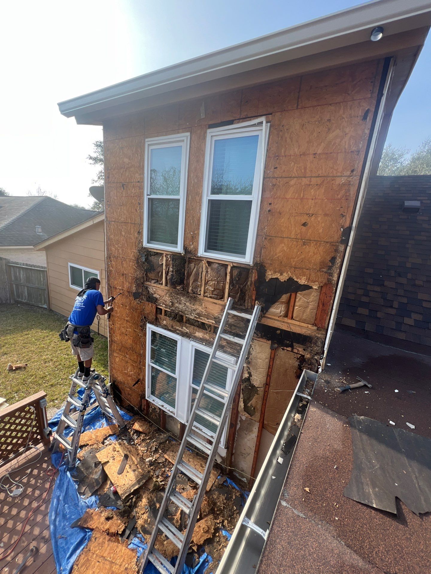 Installing Windows on a Submarine  by Bayfront Roofing and Construction