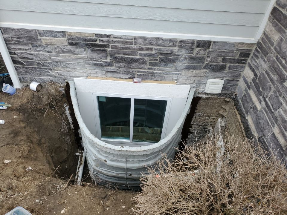 Egress Window Installation using Rockwell Egress Fiberglass Egress Window Well by Toledo Basement Repair 