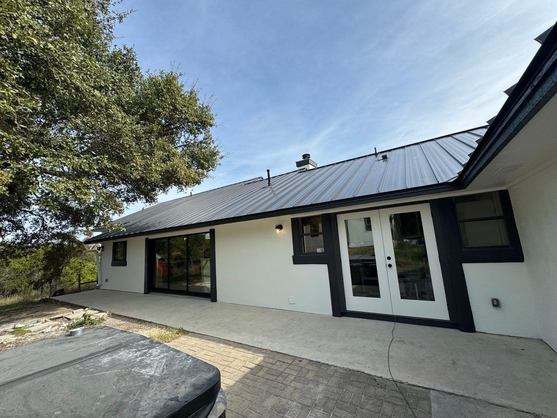 Residential Roofing Installation using Standing Seam Metal (Color, 500 Kynar Finish) in Matte Black by Texas Choice Roofing