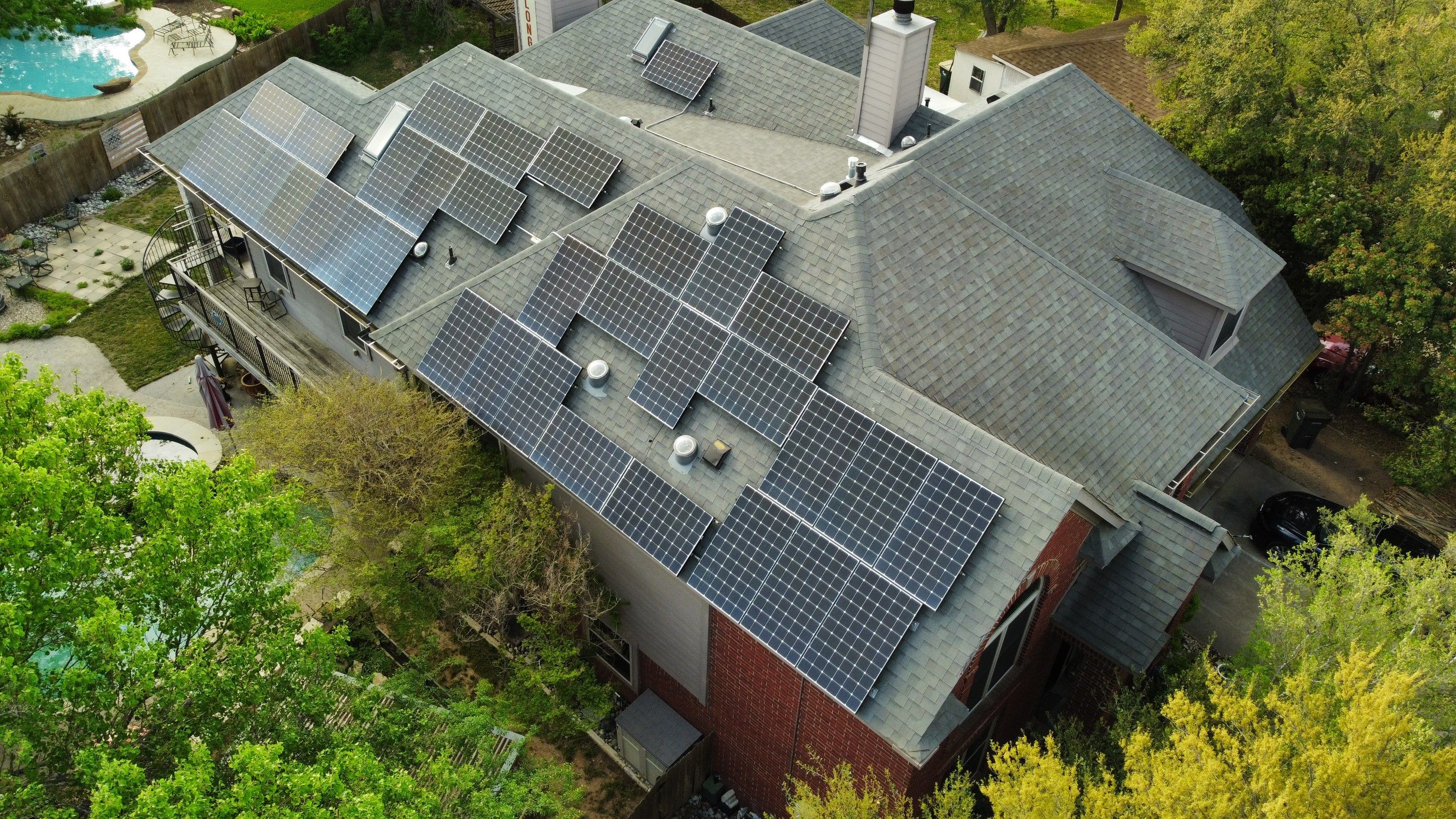 Residential Roof Replacement and Solar Panel Integration in Austin by Caliber Restoration LLC