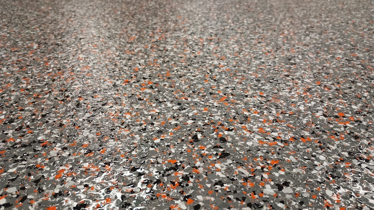 Equipment Share Commercial Floor Transformation using Smoke w/ 5% Orange by Croc Coatings, LLC