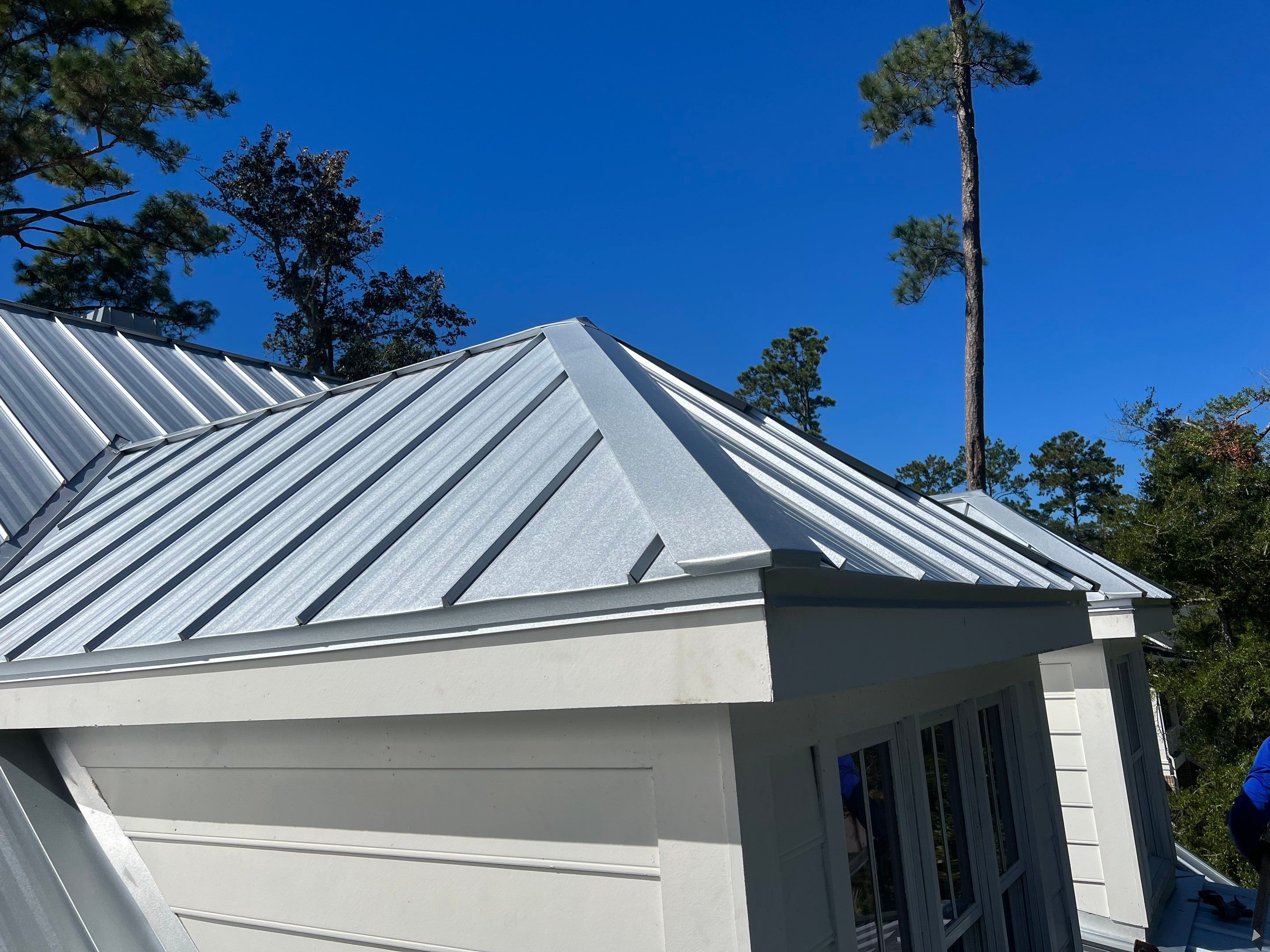 Roof Replacement using Standing Seam Metal by Rainstoppers Roofing