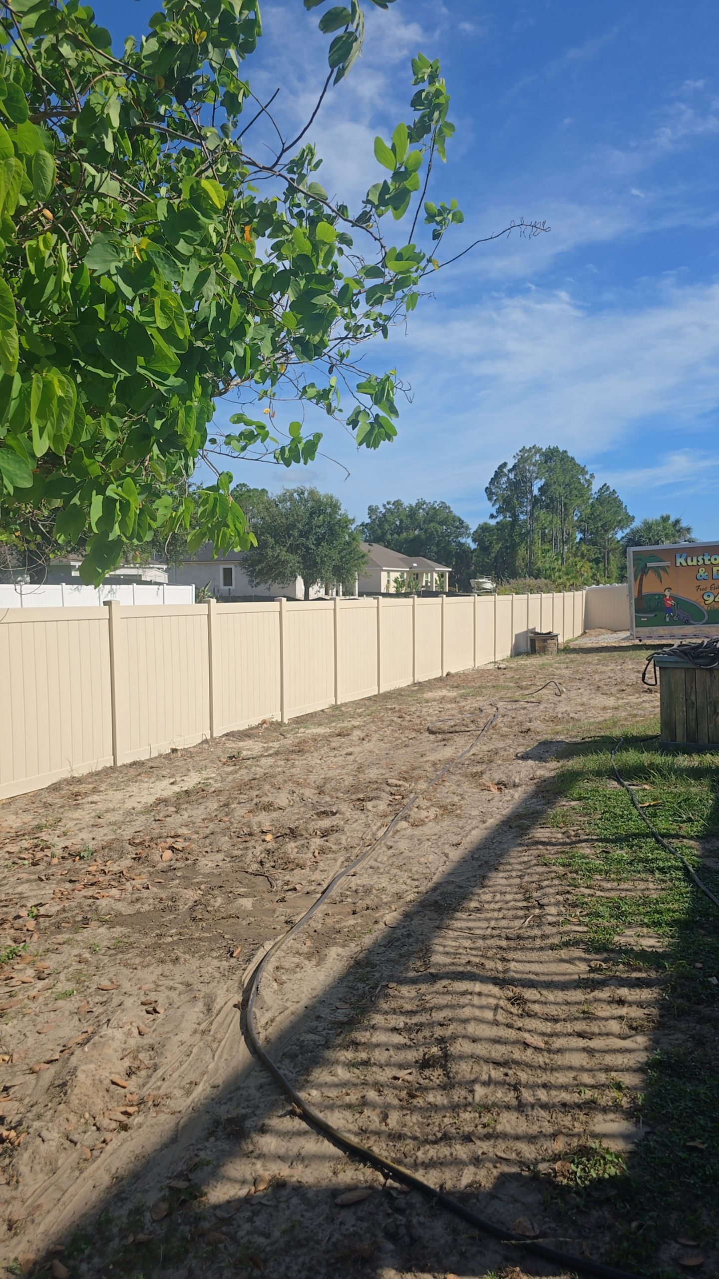 Tan Vinyl Privacy Fence and Gate Installation in North Port by True Fence LLC