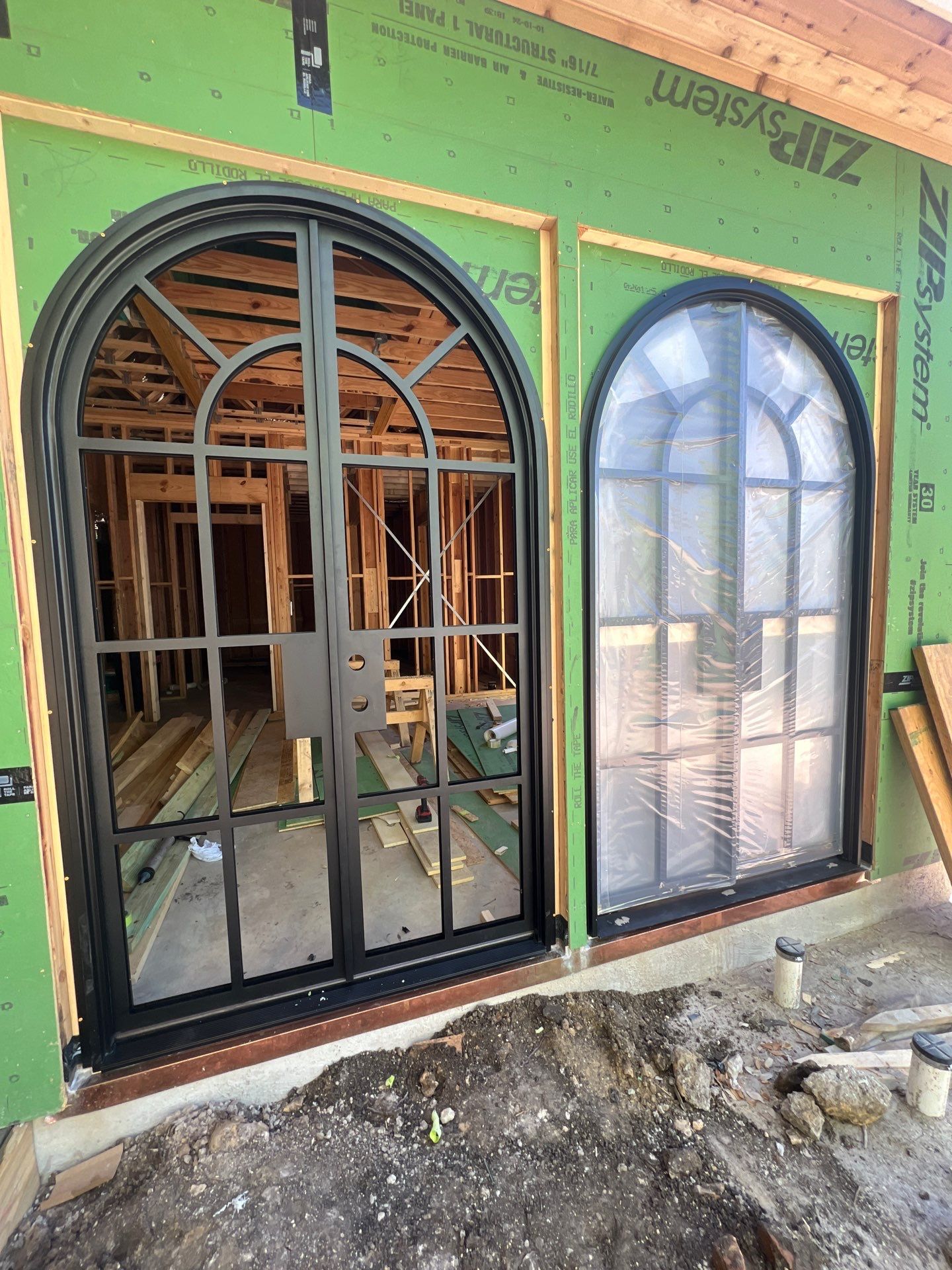 Arched Black Metal French Door Installation and Finishing in Fort Worth by Solara Custom Living