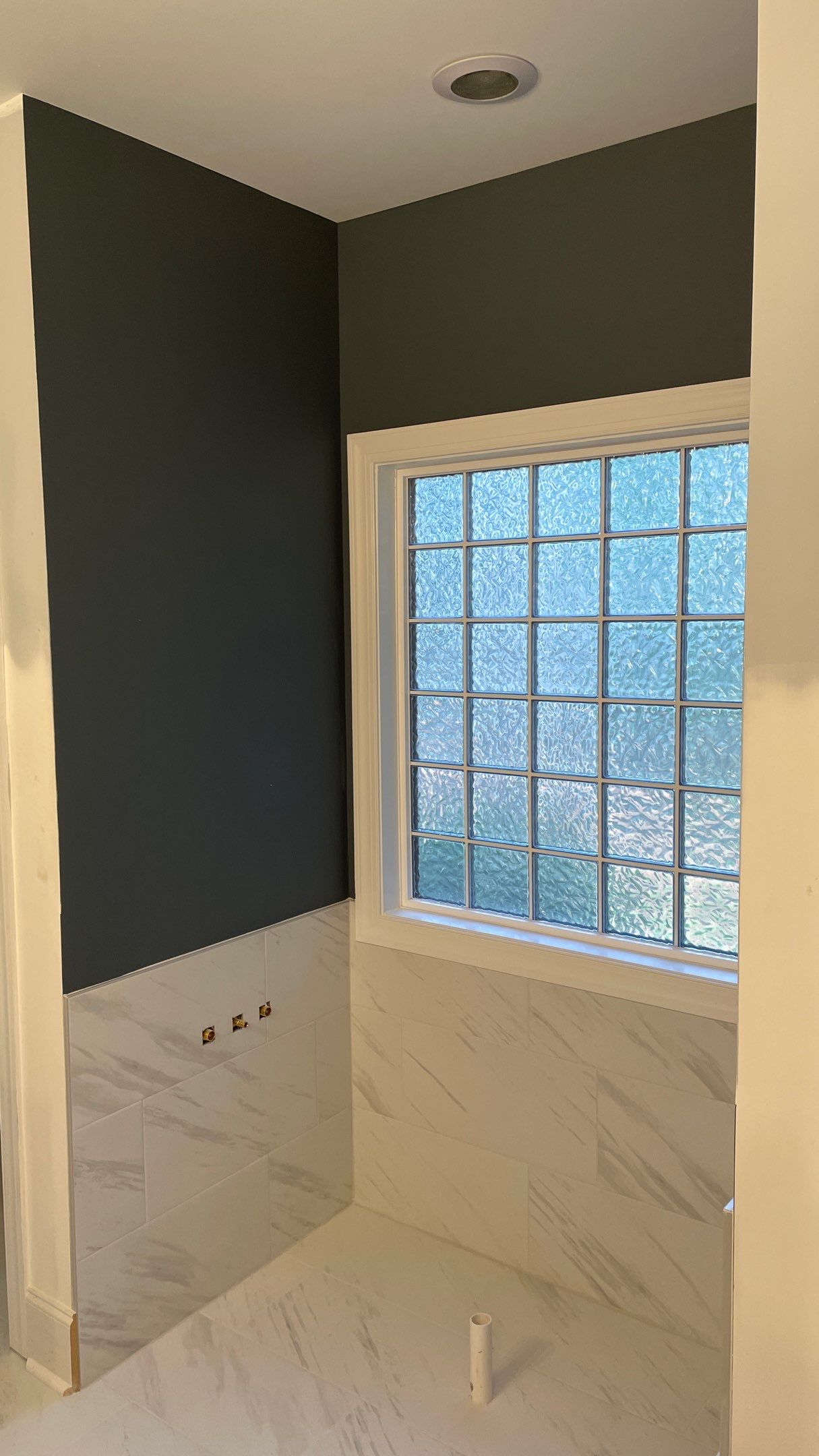 Bright Bathroom Remodel with Wall Removal, Stand Alone Tub and New Vanity by Footprints Floors of Coastal Carolina