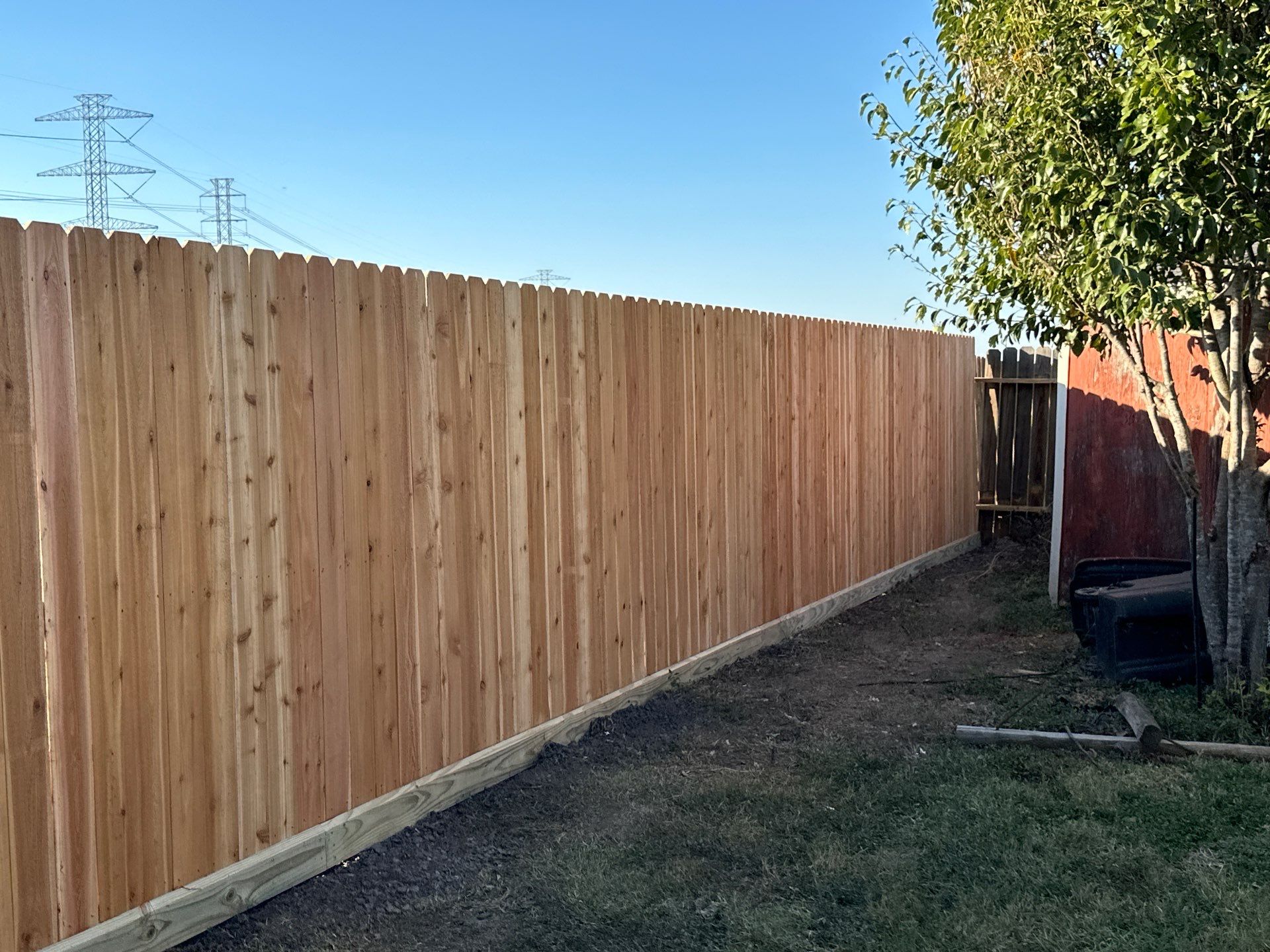 Beautiful Wood fence with metal posts by Tim's Fences