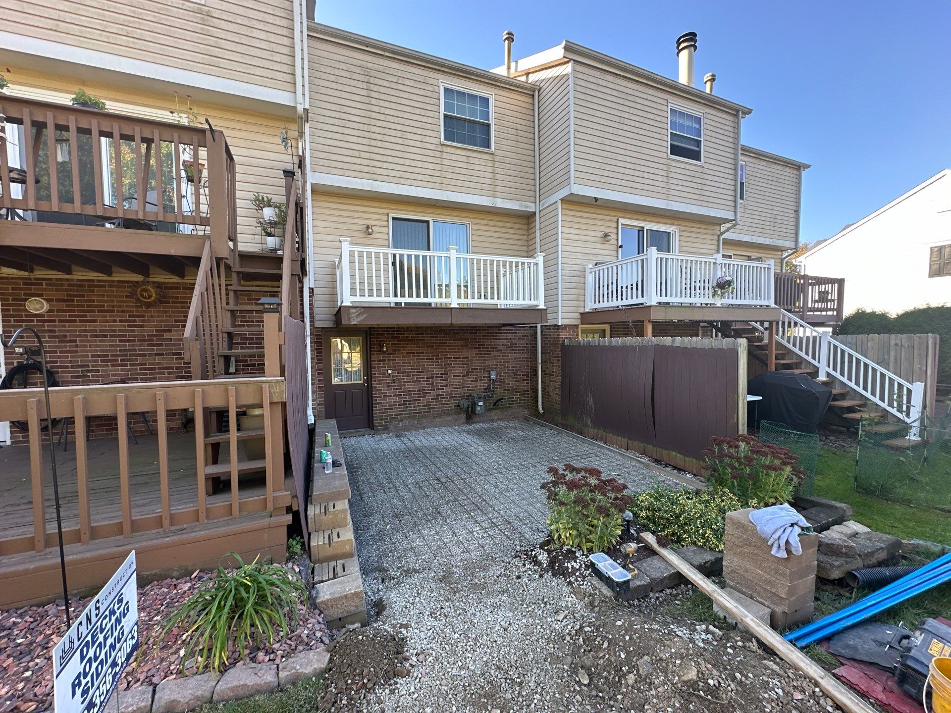 Stamped concrete and redeck  by Cousins Roofing Siding & Decks
