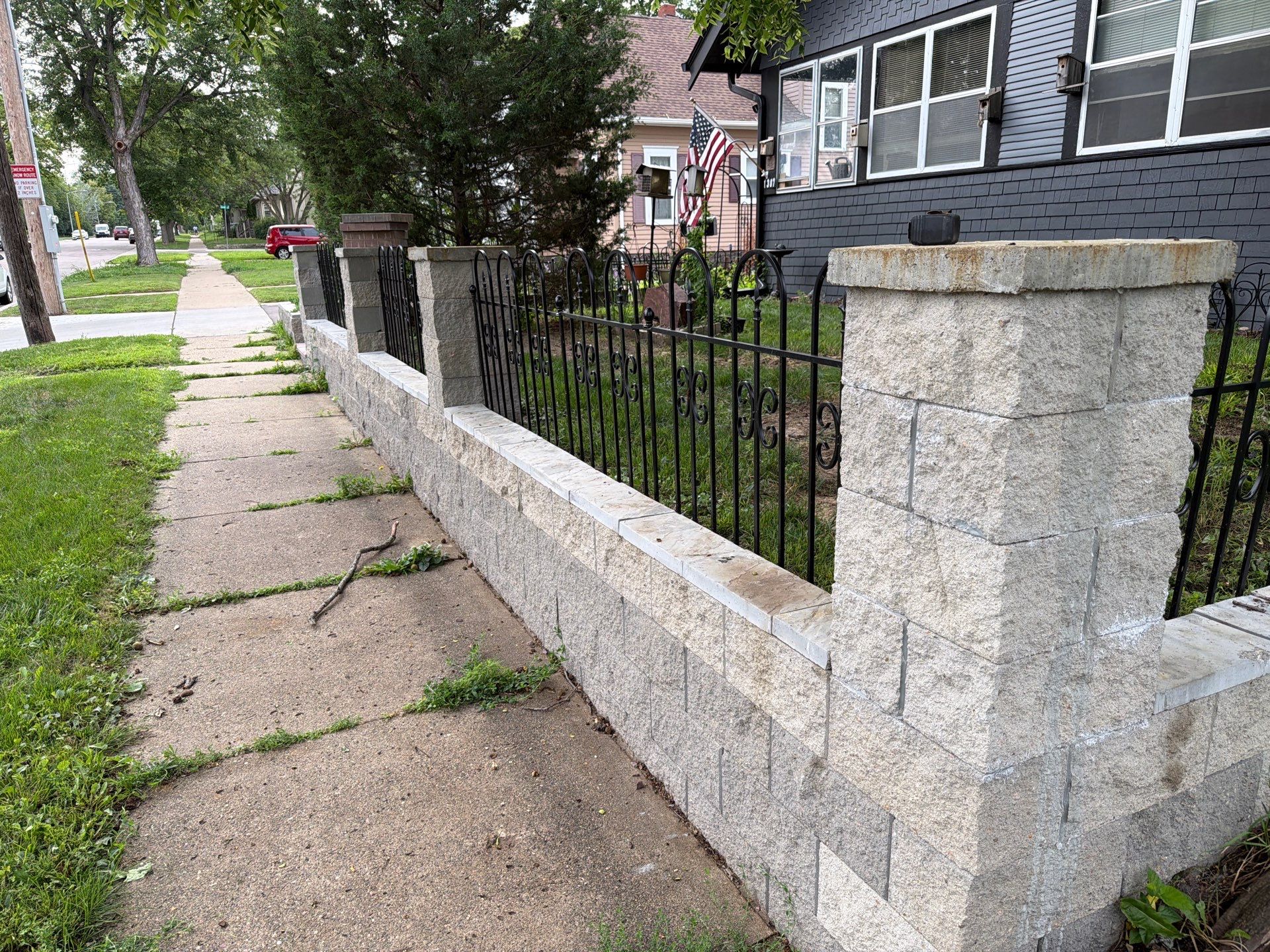 Exterior Masonry Painting for a Sioux Falls Retaining Wall by Select Painting, Coatings & Garage Cabinets