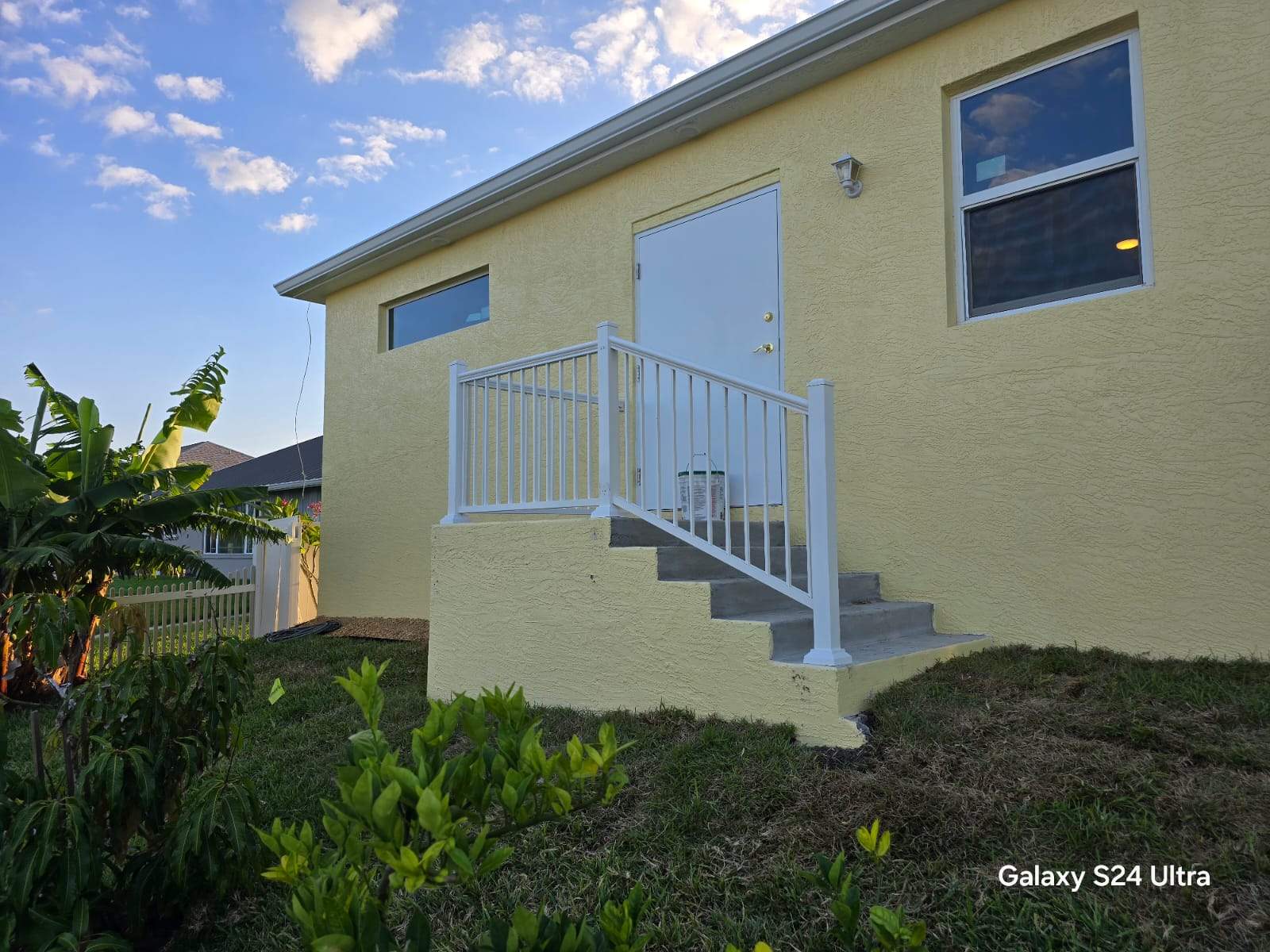 Vinyl Privacy Fence and Porch Railing Installation in Port Charlotte by True Fence LLC