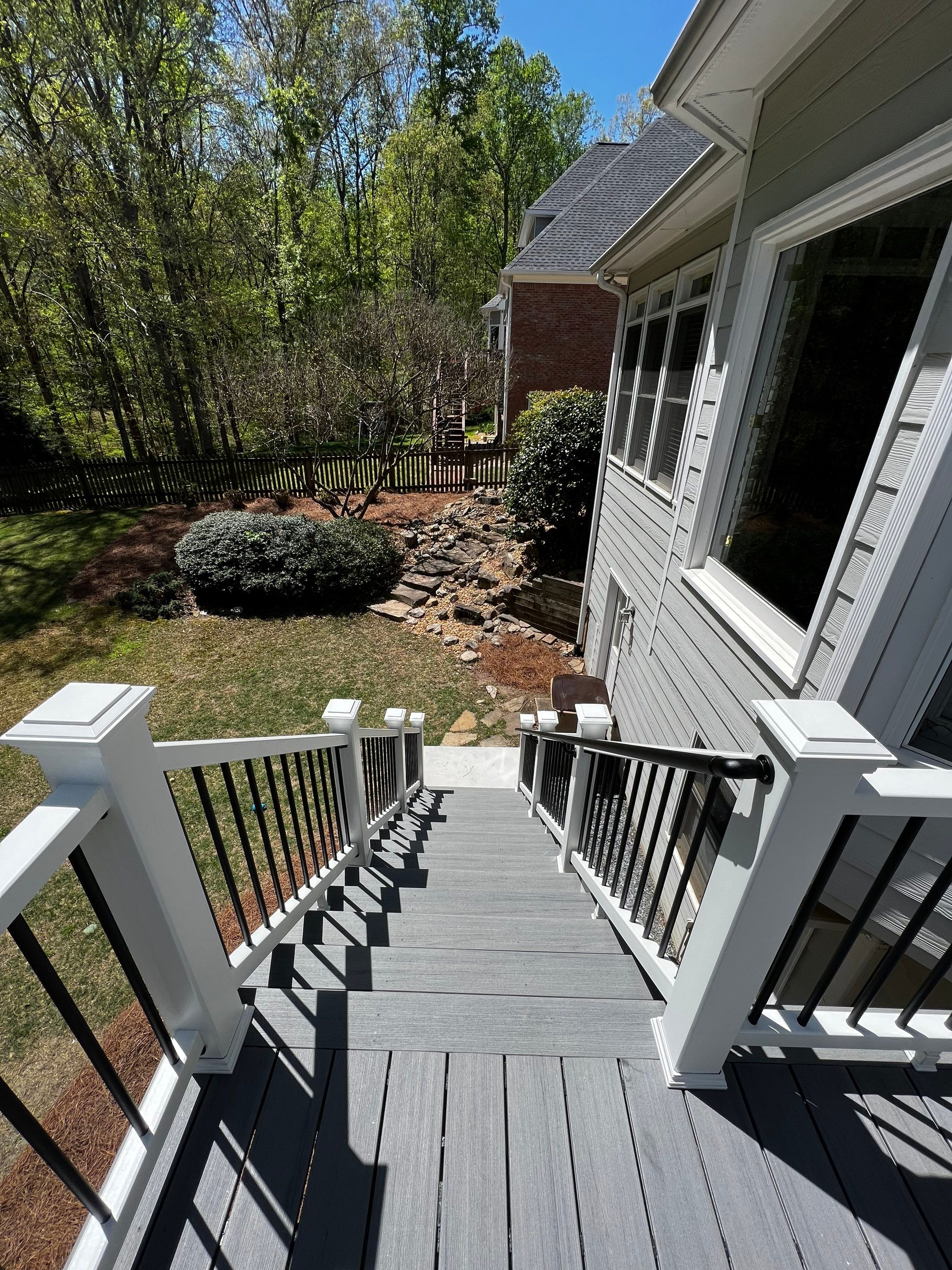 Elevated Grey Composite Deck Installation in Woodstock by Swift Home Renovations 