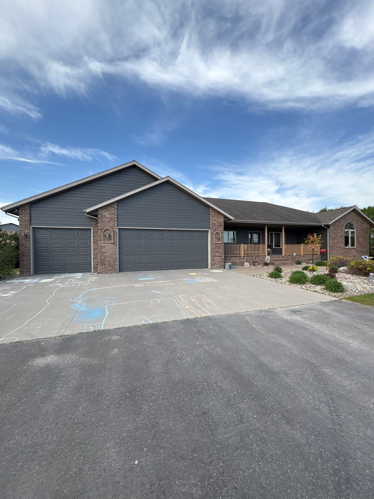Full Exterior Siding Transformation and Trim Update in Garretson by Select Painting, Coatings & Garage Cabinets