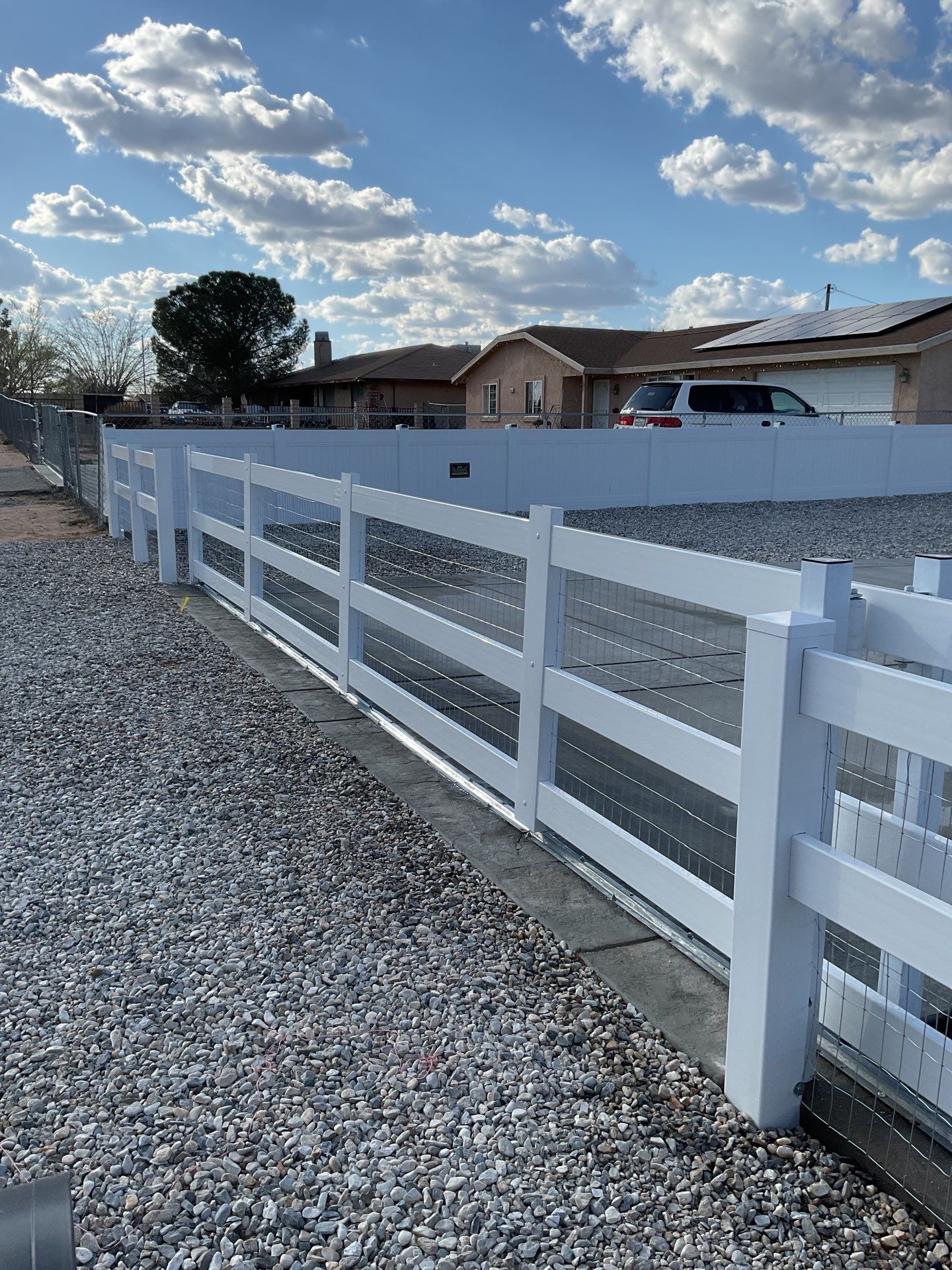 Wrought Iron Frame Ranch Style Sliding Gates by Fence Guys Inc.