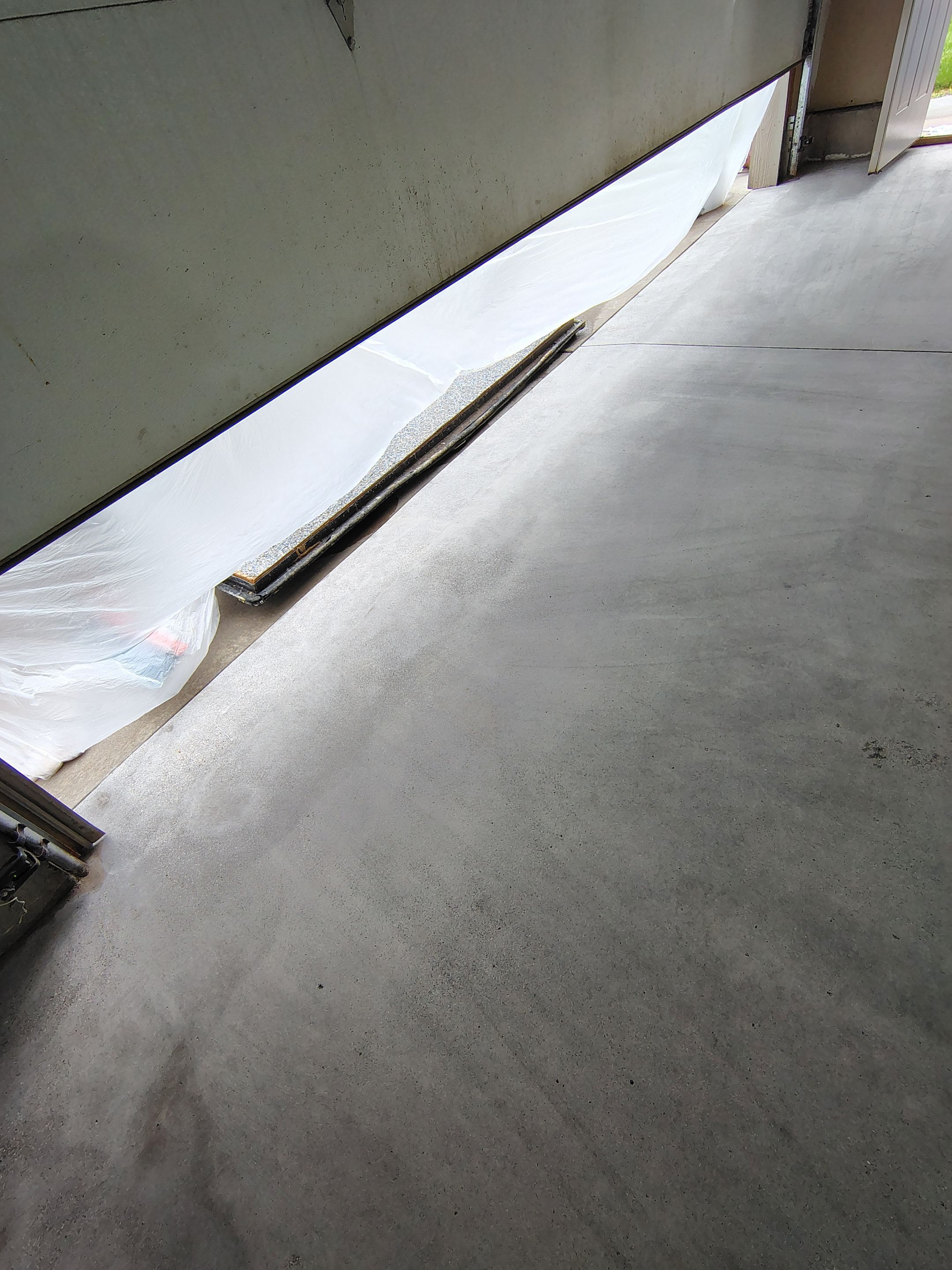 Multi-Car Garage Concrete Coating and Epoxy Finish in Sioux Falls by Select Painting, Coatings & Garage Cabinets