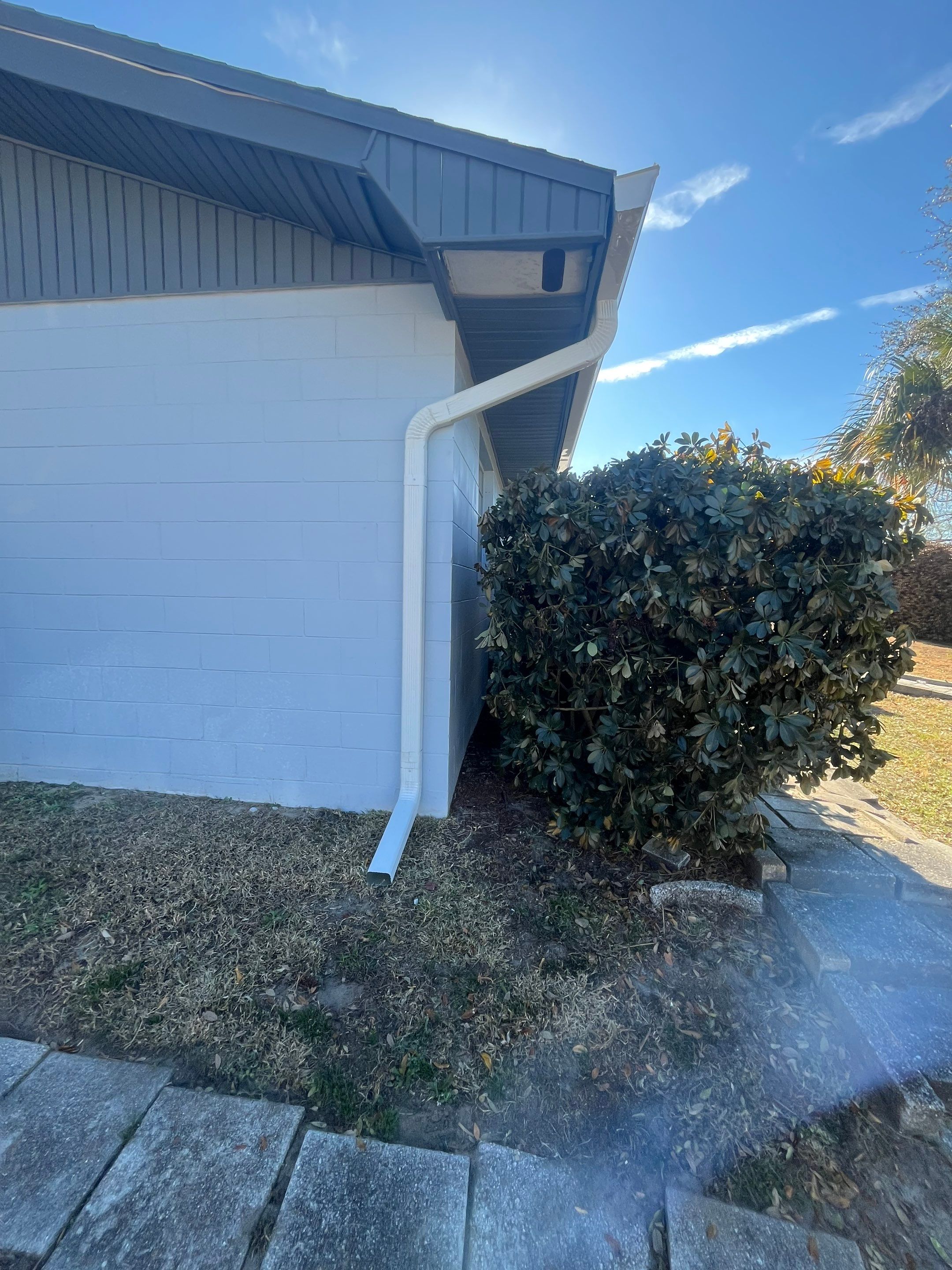 Downspout Installation using Downspout Extension and new Gutters in Winter Haven FL by Gutter Professors