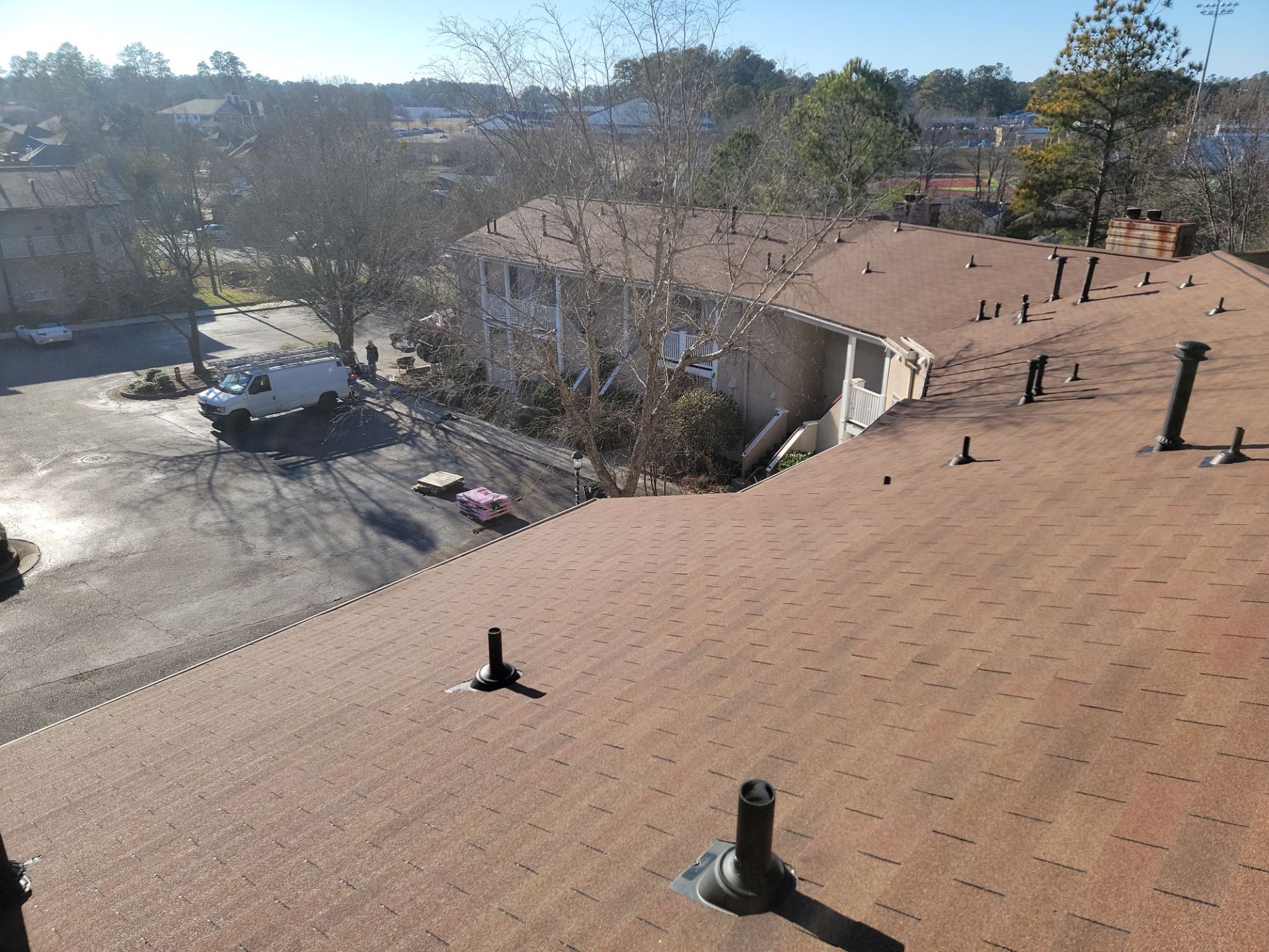 Commercial Roofing Installation using Owens Corning Autumn Brown by Inspector Roofing and Restoration