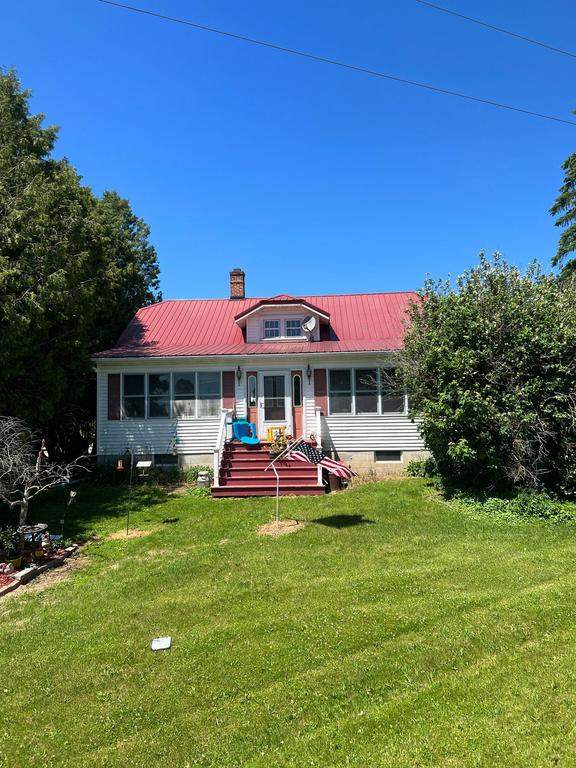 Residential Roof Installation with Red Pro Rib Metal Roofing in Adell, WI by Gellings Roofing and Siding LLC