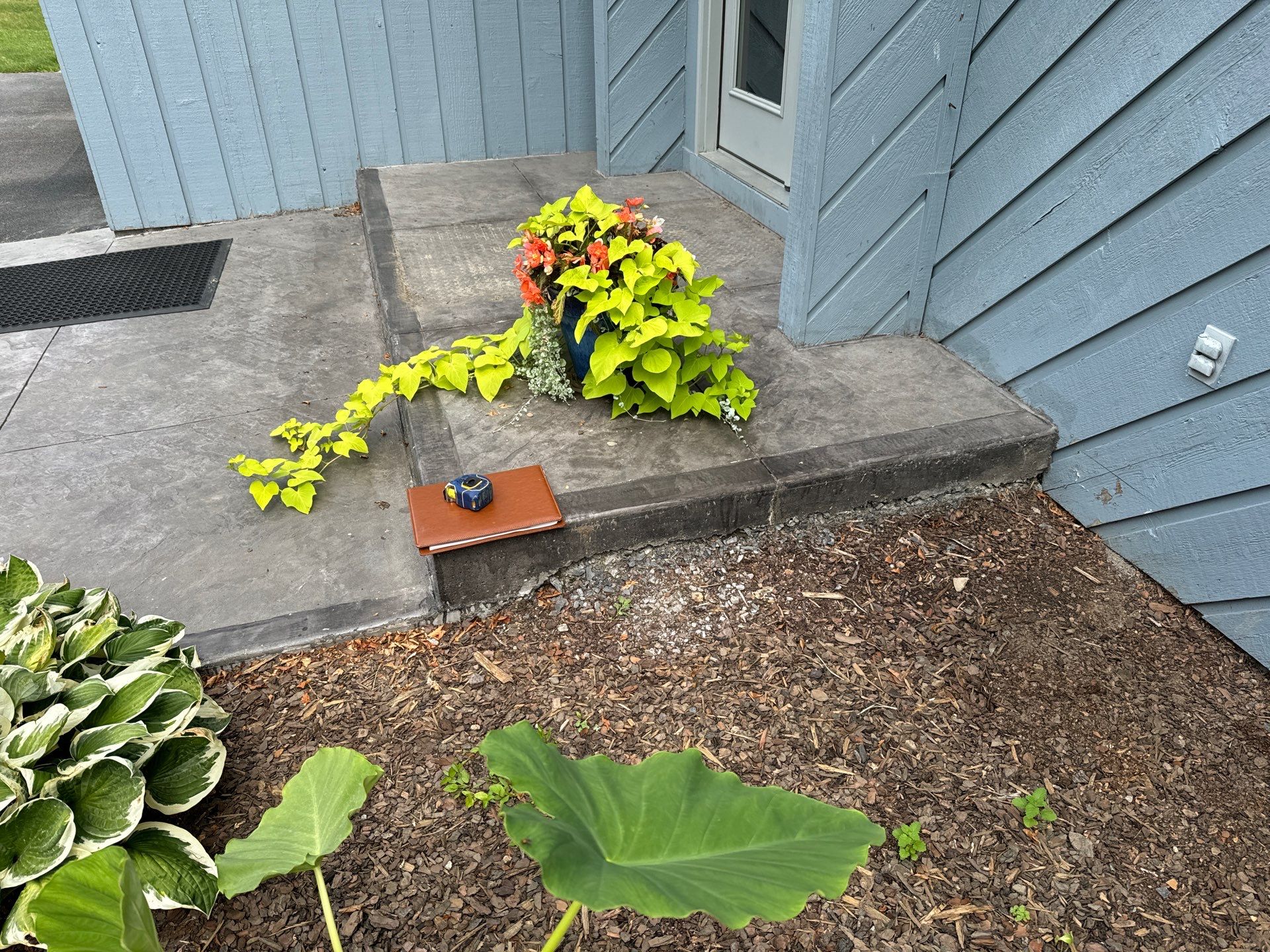 Charcoal Release Border with Broom Finish  by NG Masonry & Construction LLC