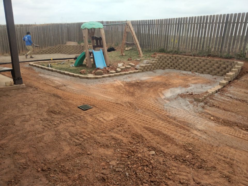 Retaining wall / Playground by Clays Services Inc