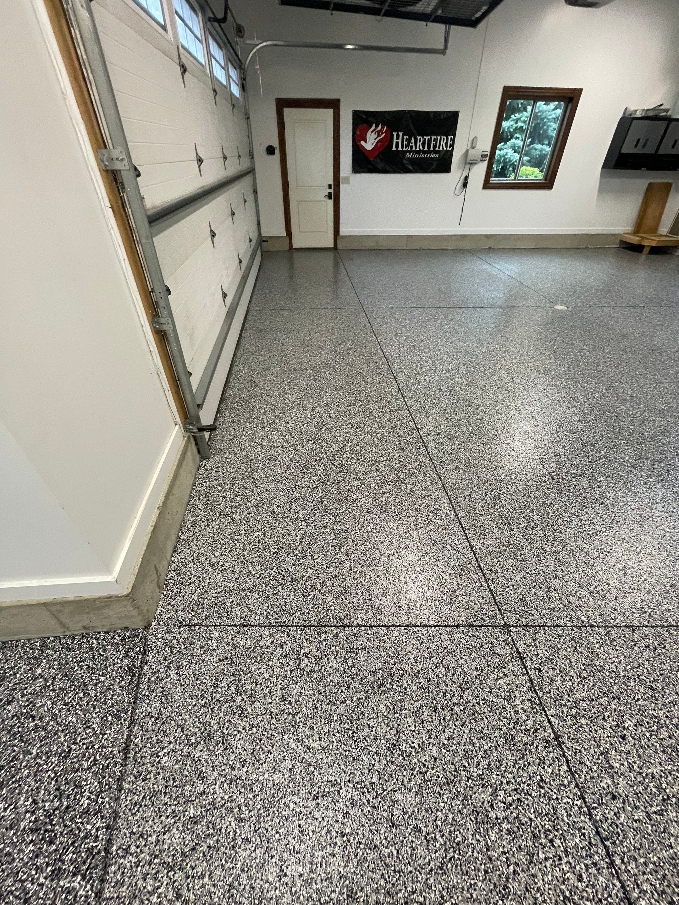 Garage Floor Coating and Domino Flake Finish in Sioux Falls by Select Painting, Coatings & Garage Cabinets