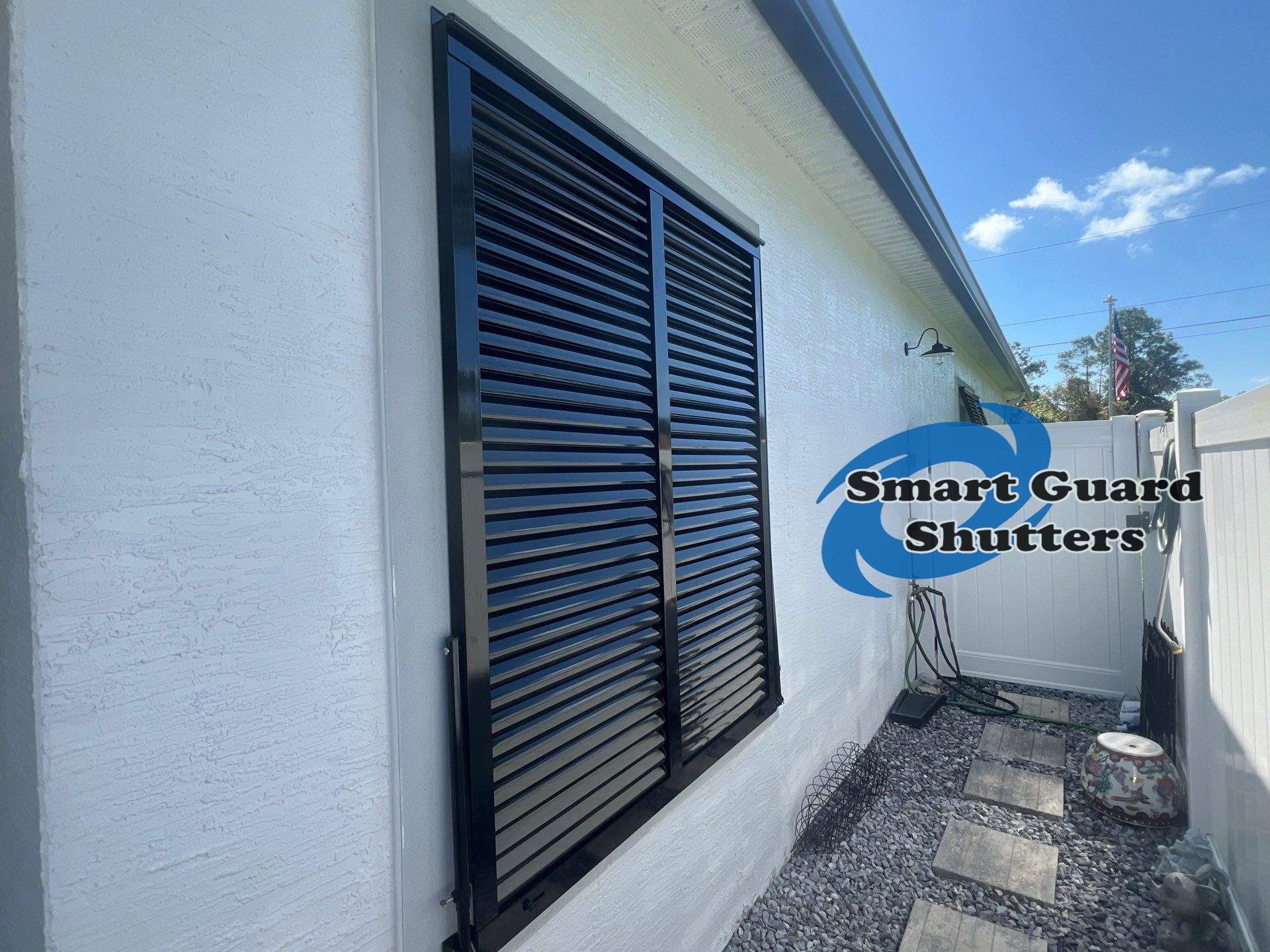 Impact Bahama Shutters in Jet Black by Smart Guard Shutters