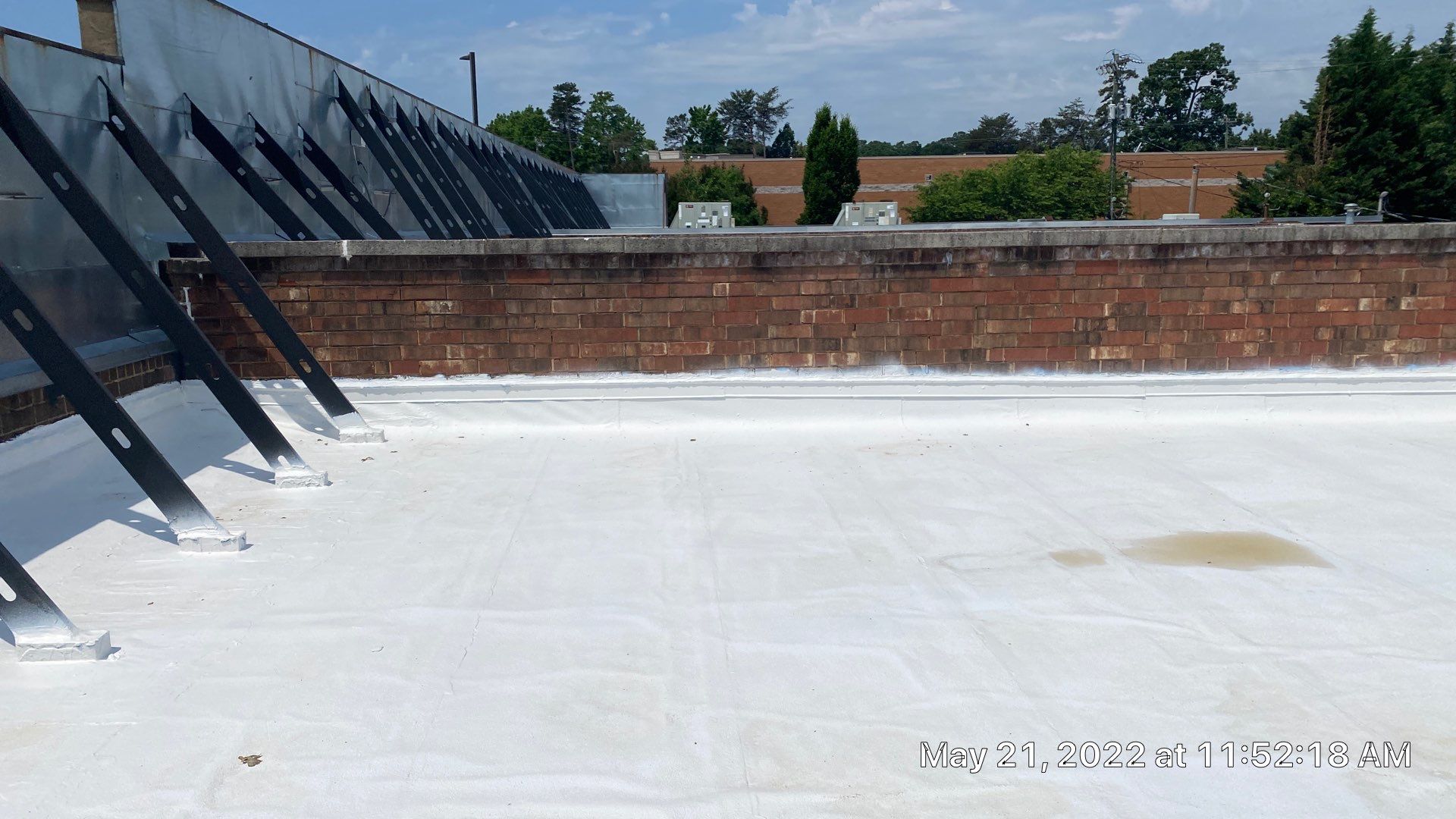 Commercial Roof Coating using Fiberseal basecoat and Silicon Topcoat by Just In Time Roofing and Restoration